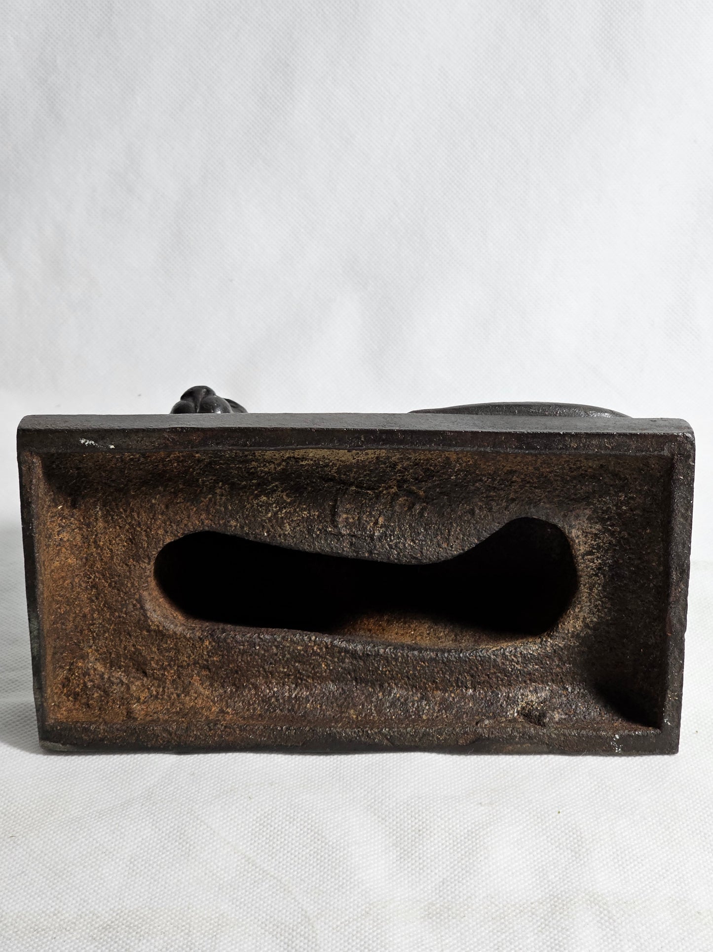 A Cast Iron Sculpture of a Recumbent Lion, on a Rectangular Base,
