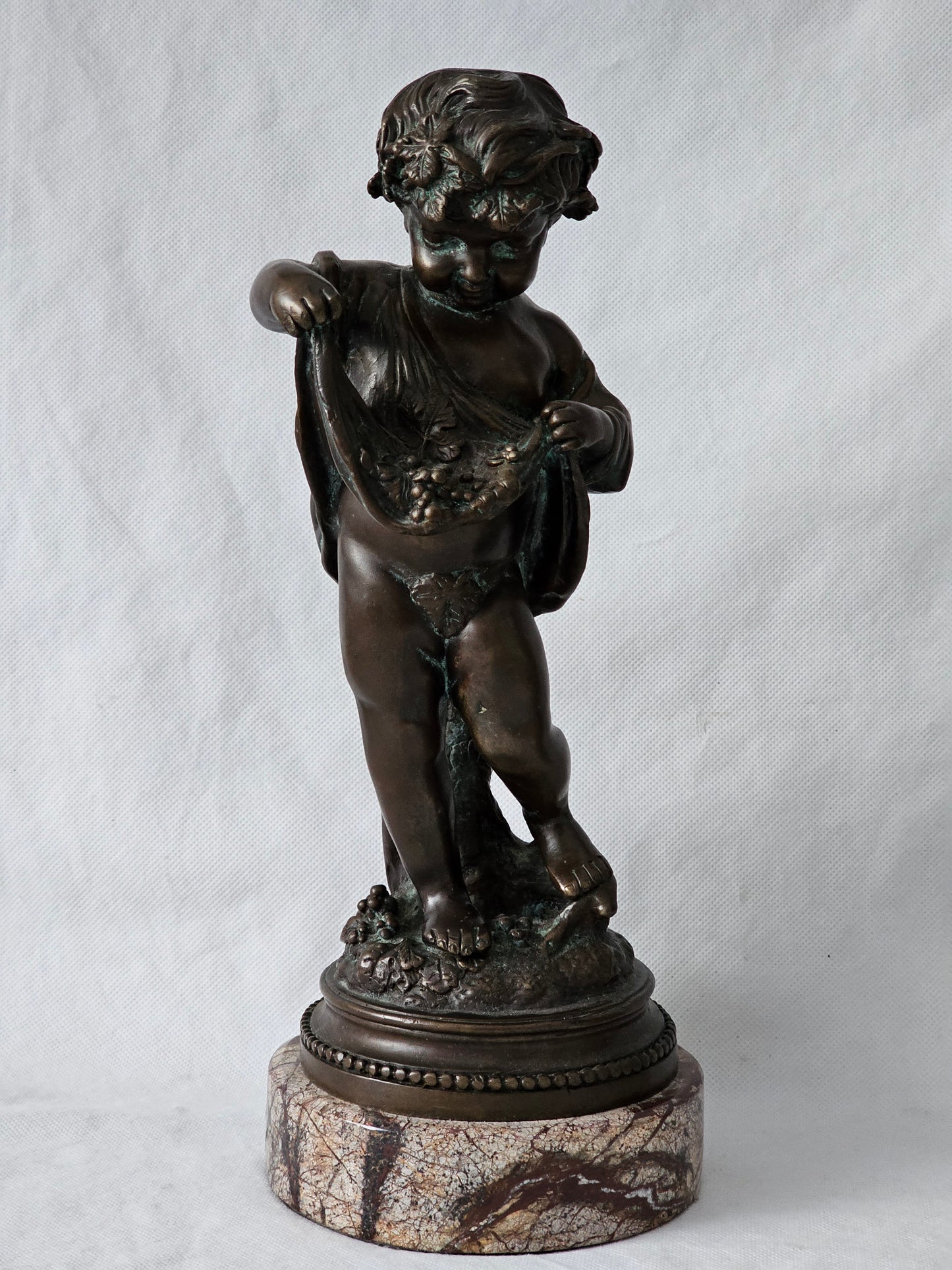 An Antique Pair of Bronze Patinaed Putti Cherubs on Marble Plinths,