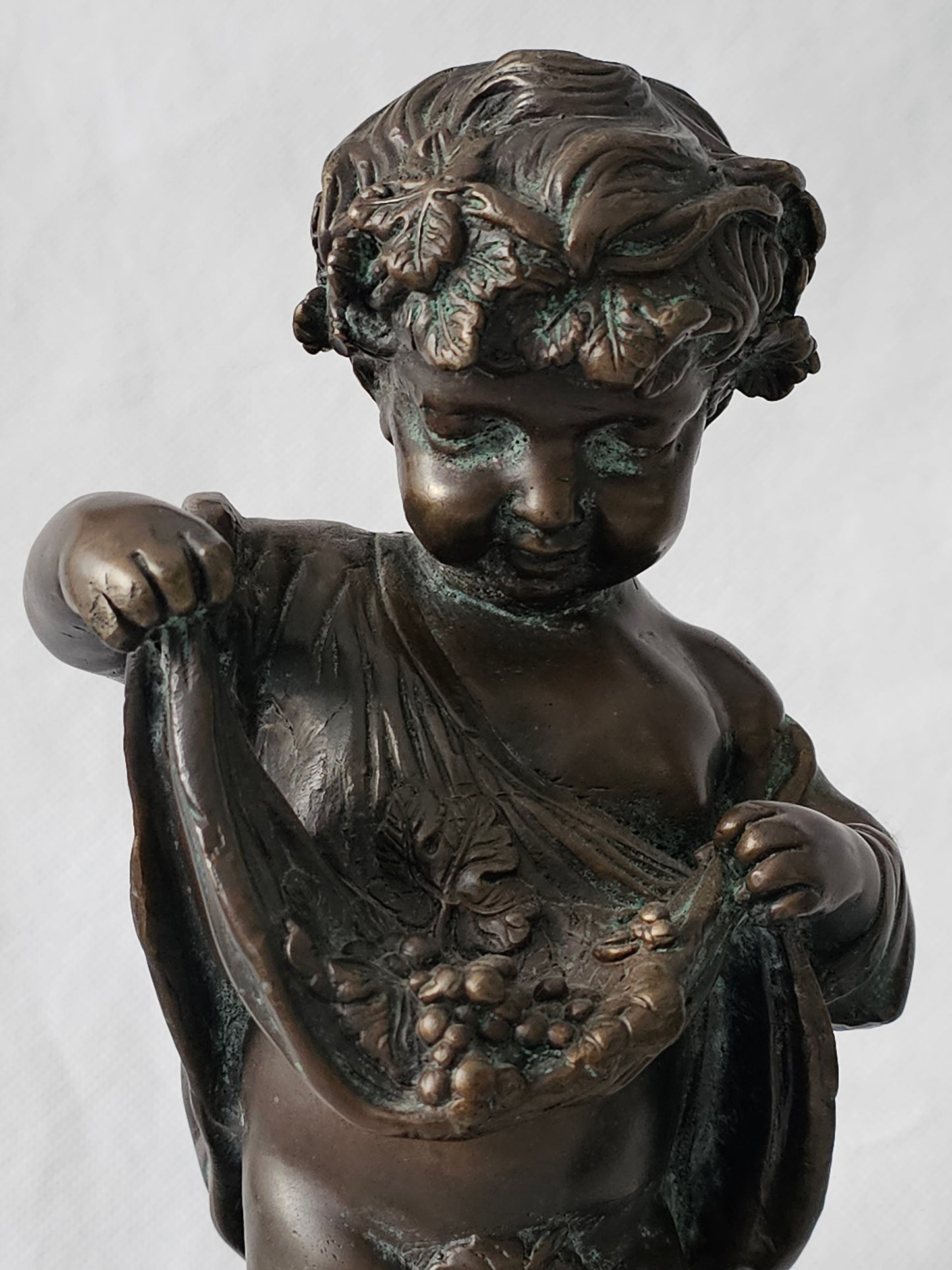 An Antique Pair of Bronze Patinaed Putti Cherubs on Marble Plinths,