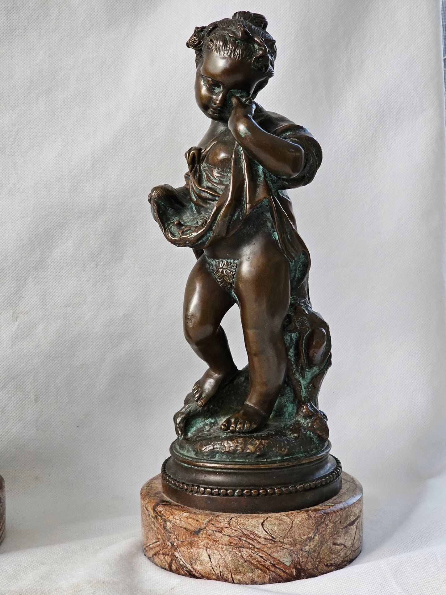 An Antique Pair of Bronze Patinaed Putti Cherubs on Marble Plinths,