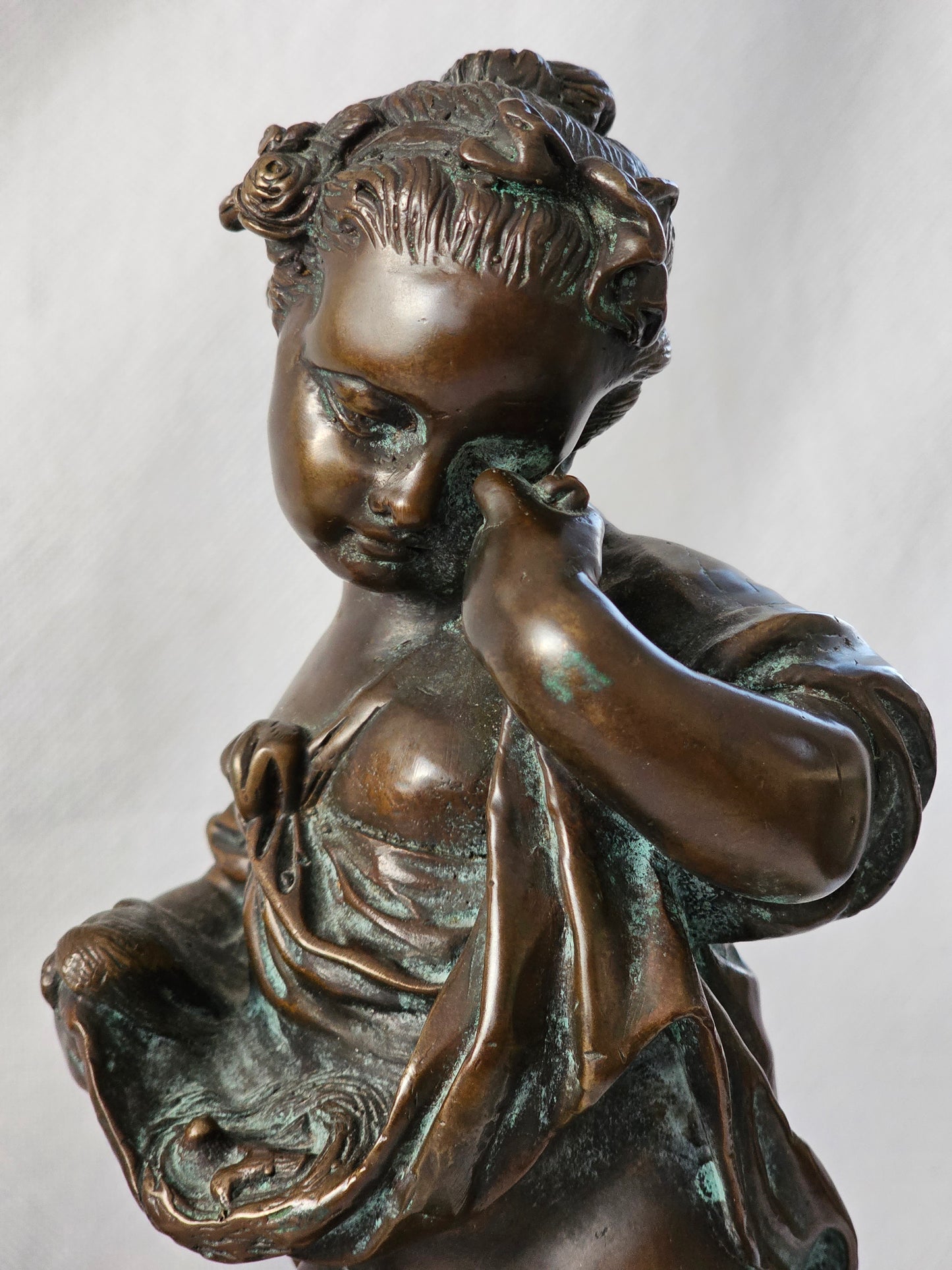 An Antique Pair of Bronze Patinaed Putti Cherubs on Marble Plinths,