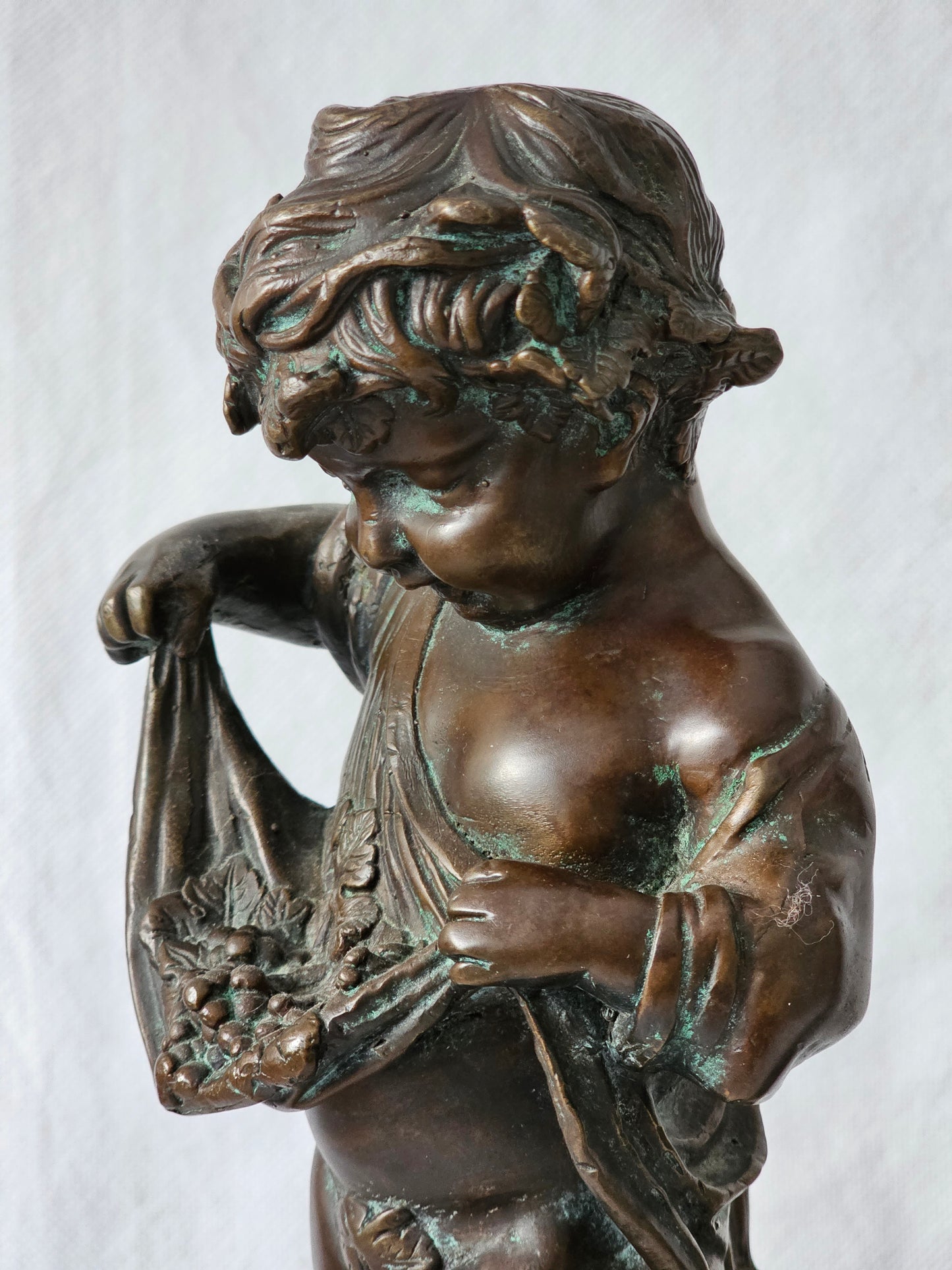 An Antique Pair of Bronze Patinaed Putti Cherubs on Marble Plinths,
