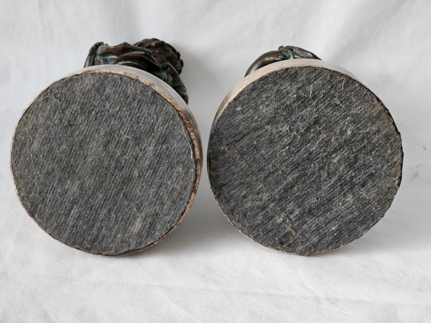 An Antique Pair of Bronze Patinaed Putti Cherubs on Marble Plinths,