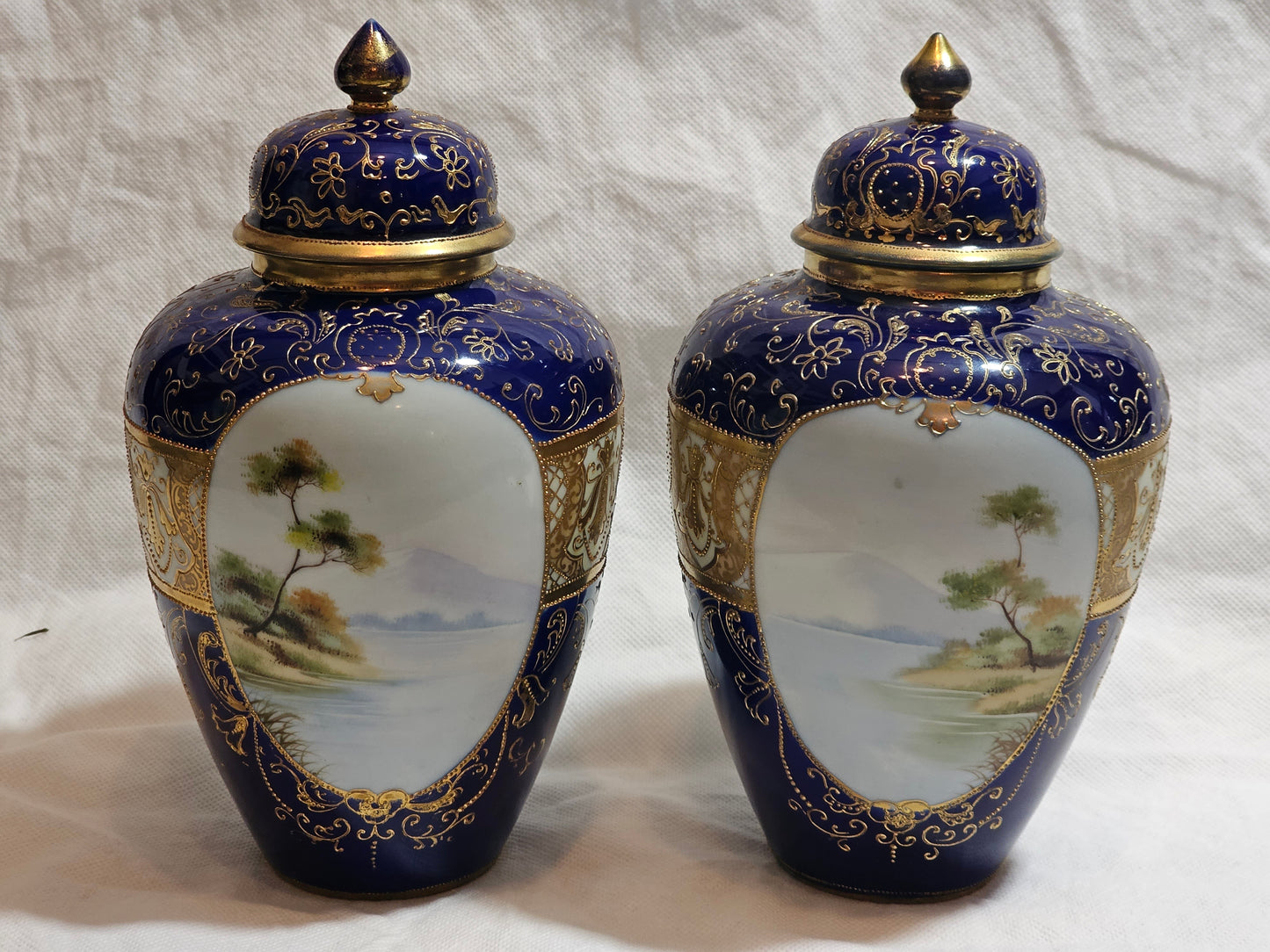 A Pair of Noritake Jars and Covers, C1930, Painted with Landscapes