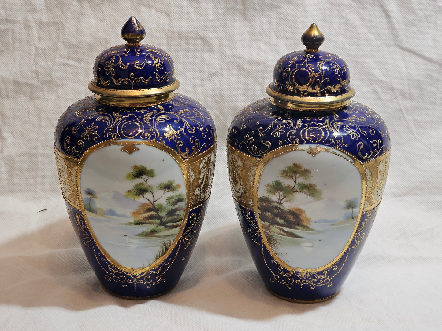 A Pair of Noritake Jars and Covers, C1930, Painted with Landscapes