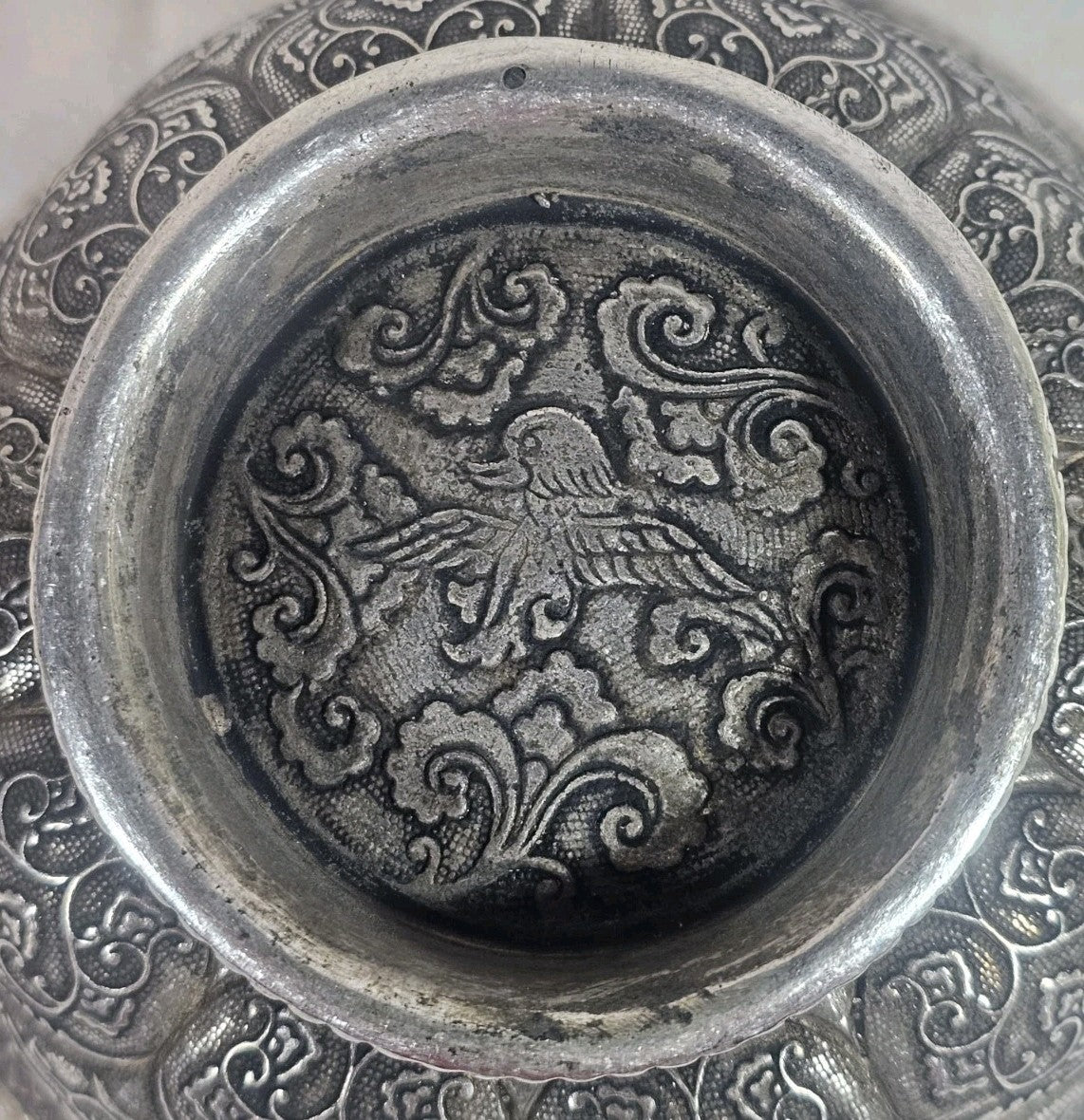 An Antique Chinese White Metal Repoussé Bowl Decorated inside and out
