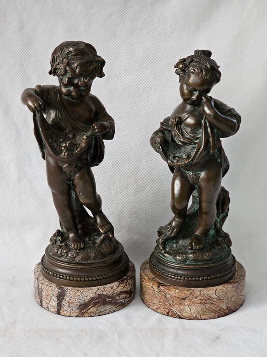 An Antique Pair of Bronze Patinaed Putti Cherubs on Marble Plinths,