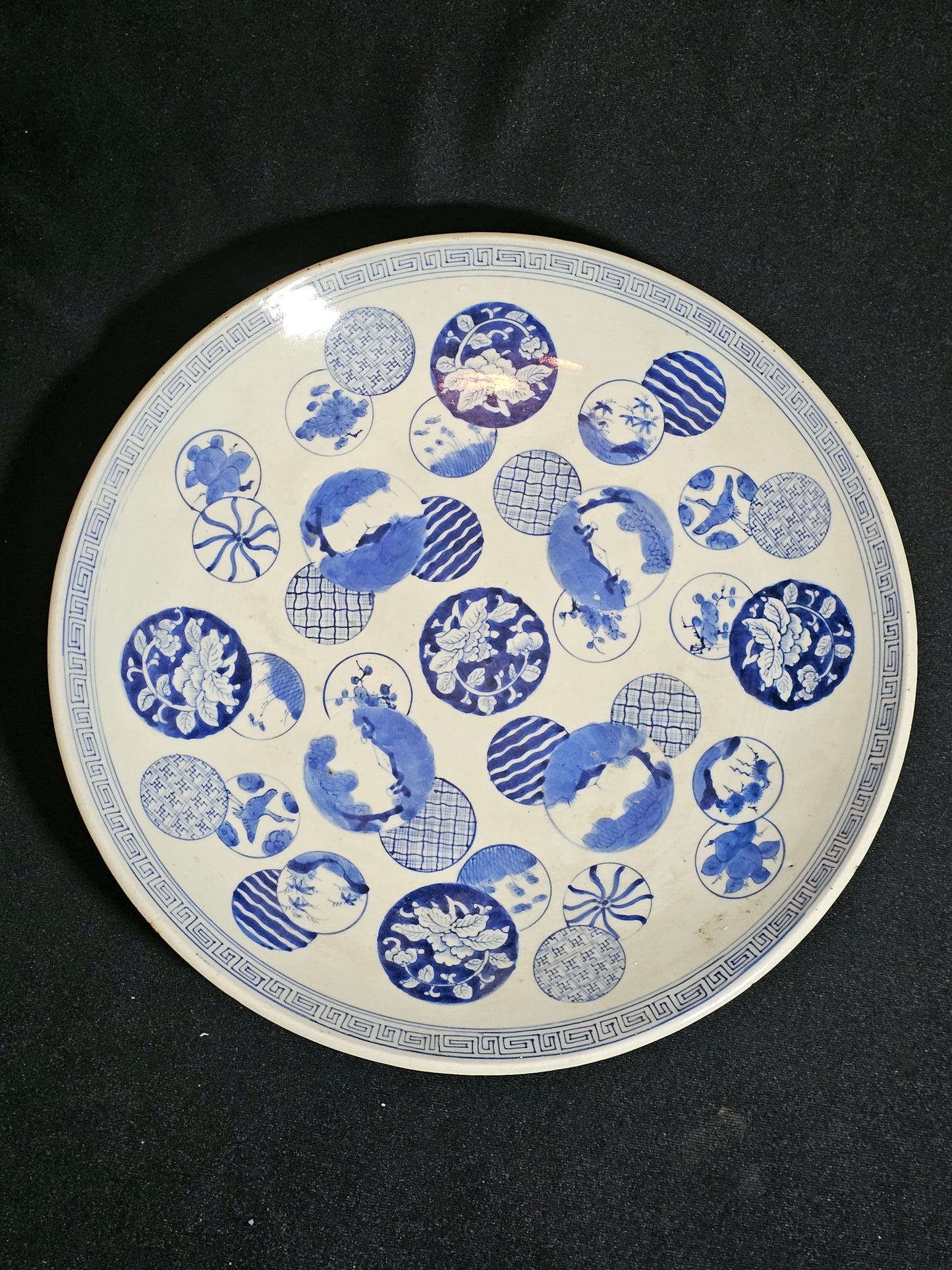 A 19thC Japanese Porcelain Charger, with Blue and White Circular Decorations