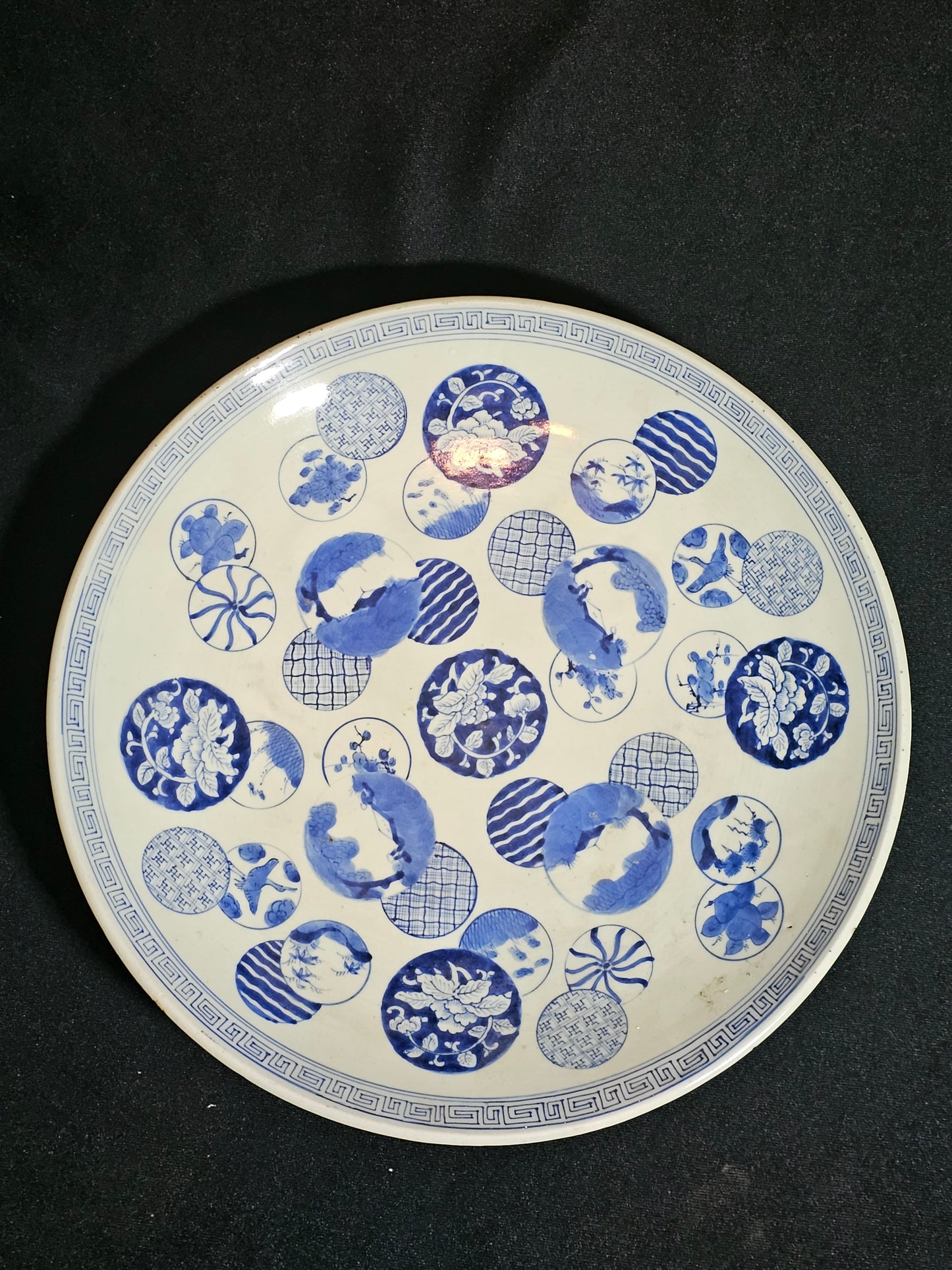 A 19thC Japanese Porcelain Charger, with Blue and White Circular Decorations