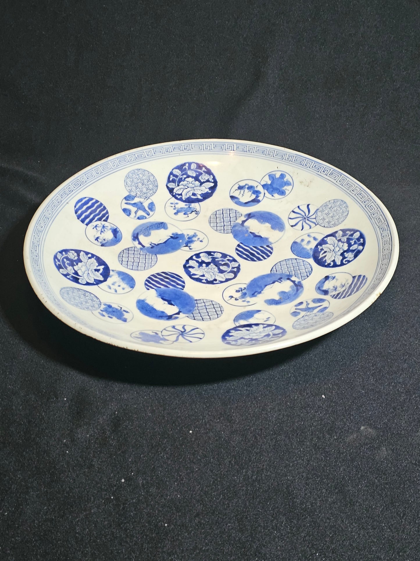 A 19thC Japanese Porcelain Charger, with Blue and White Circular Decorations