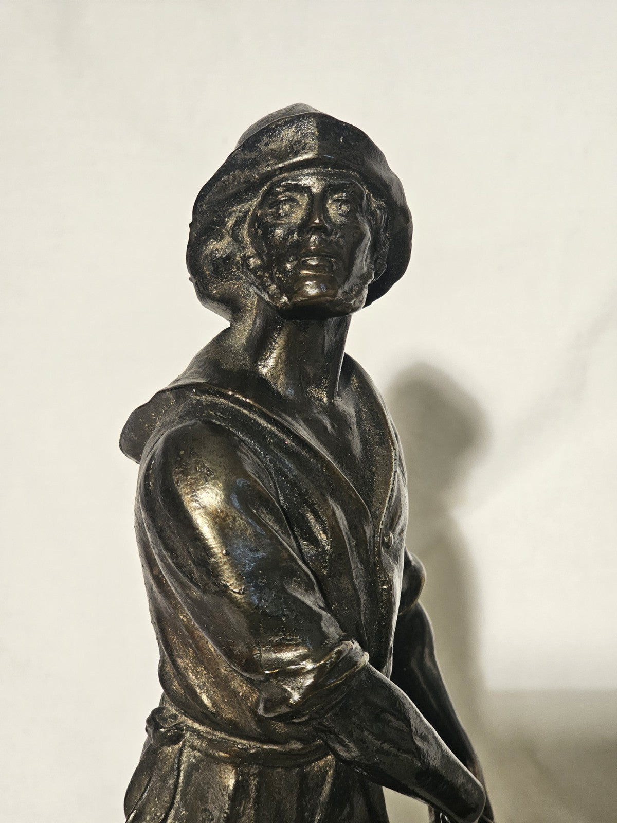 An Antique Pair of Bronzed Spelter Figures of a Fisherman and Woman,