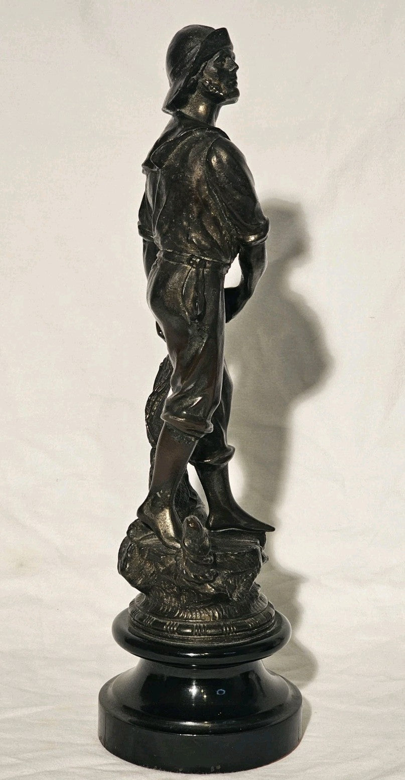 An Antique Pair of Bronzed Spelter Figures of a Fisherman and Woman,