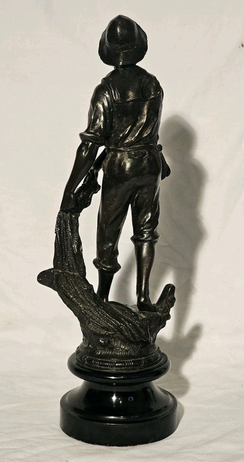 An Antique Pair of Bronzed Spelter Figures of a Fisherman and Woman,