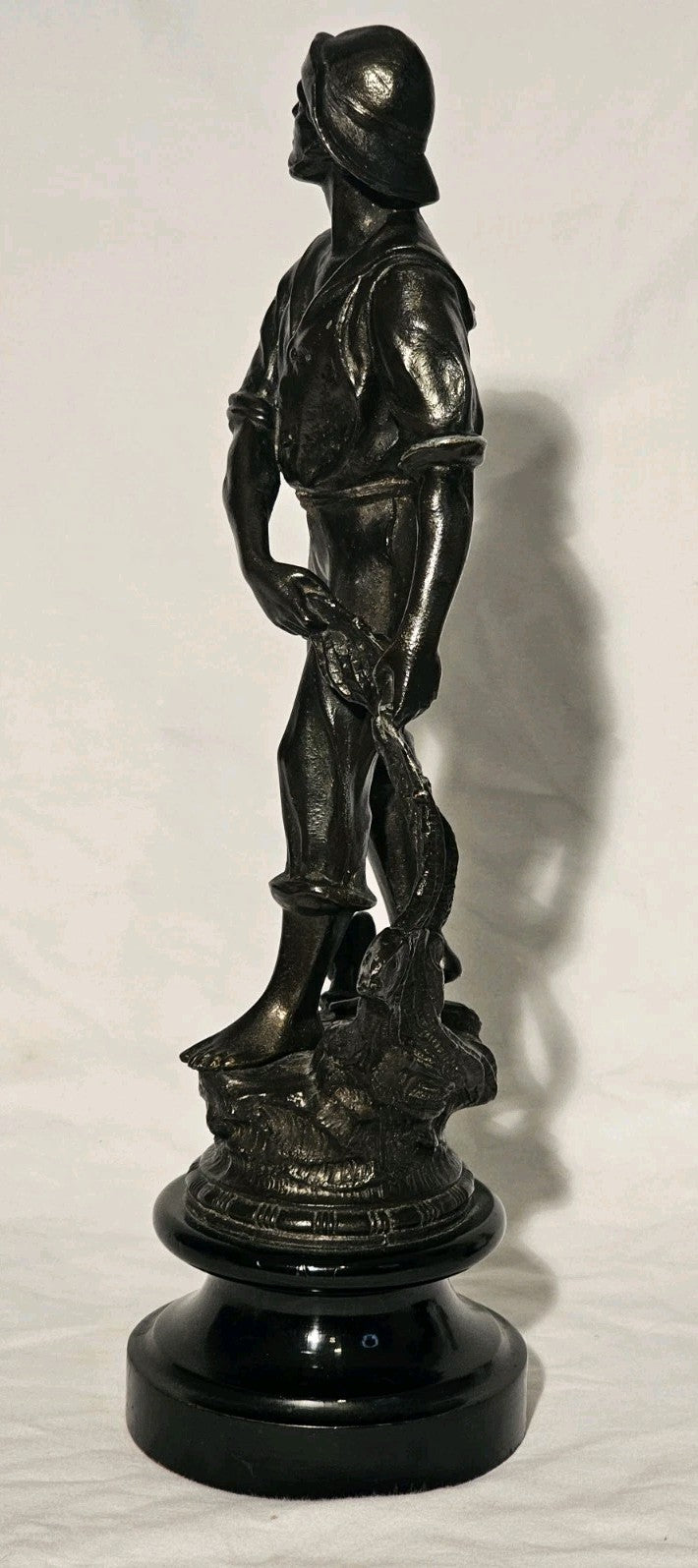 An Antique Pair of Bronzed Spelter Figures of a Fisherman and Woman,