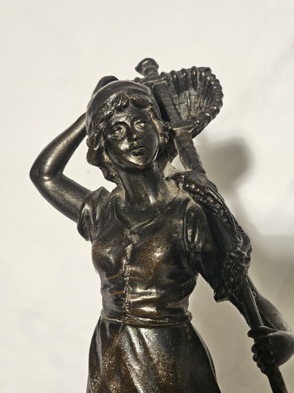 An Antique Pair of Bronzed Spelter Figures of a Fisherman and Woman,