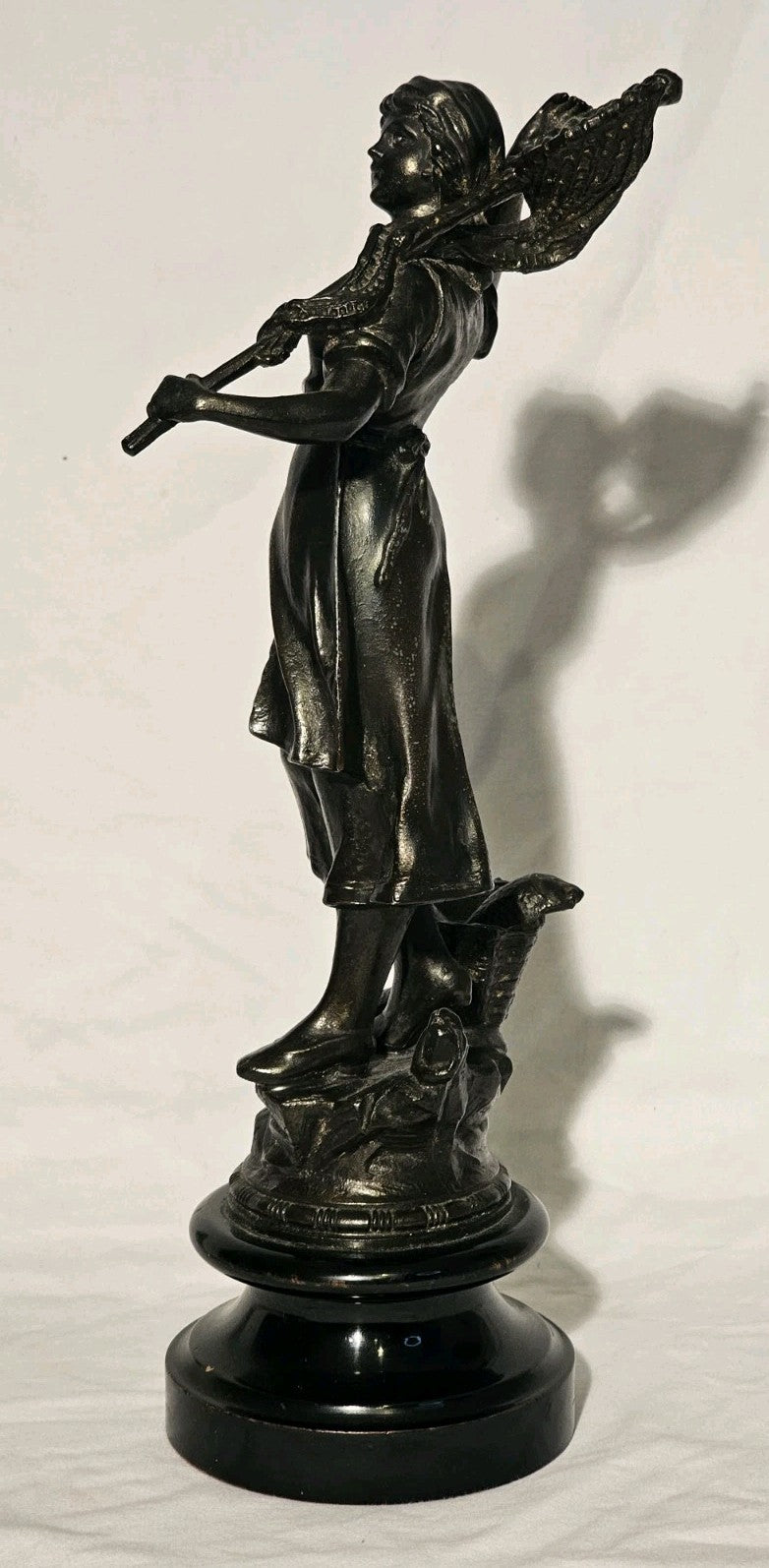 An Antique Pair of Bronzed Spelter Figures of a Fisherman and Woman,