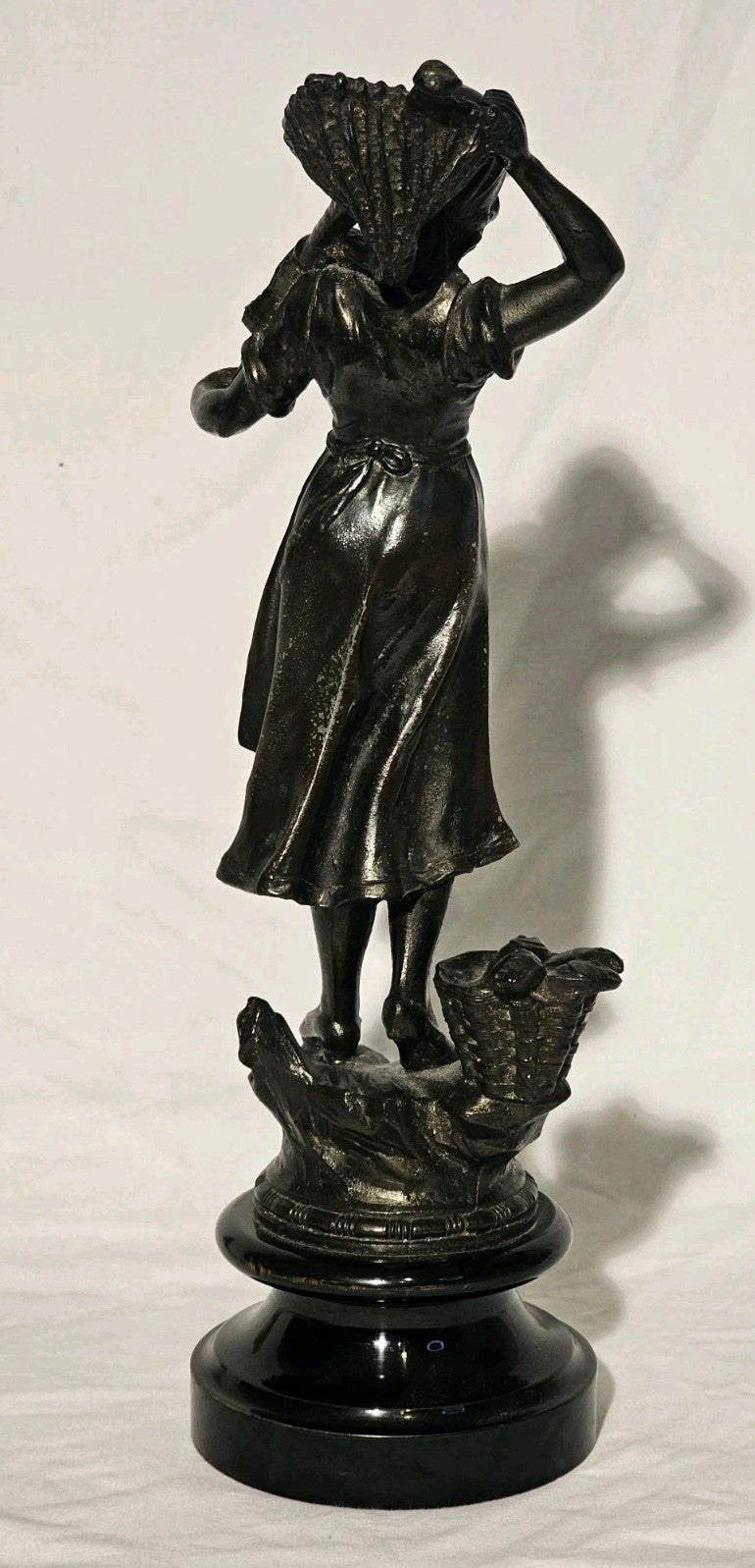 An Antique Pair of Bronzed Spelter Figures of a Fisherman and Woman,