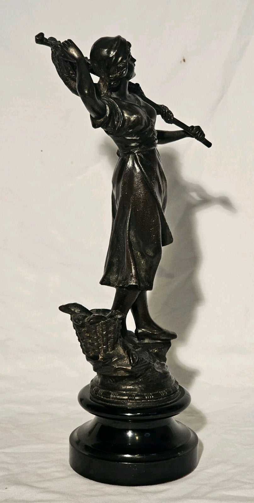 An Antique Pair of Bronzed Spelter Figures of a Fisherman and Woman,