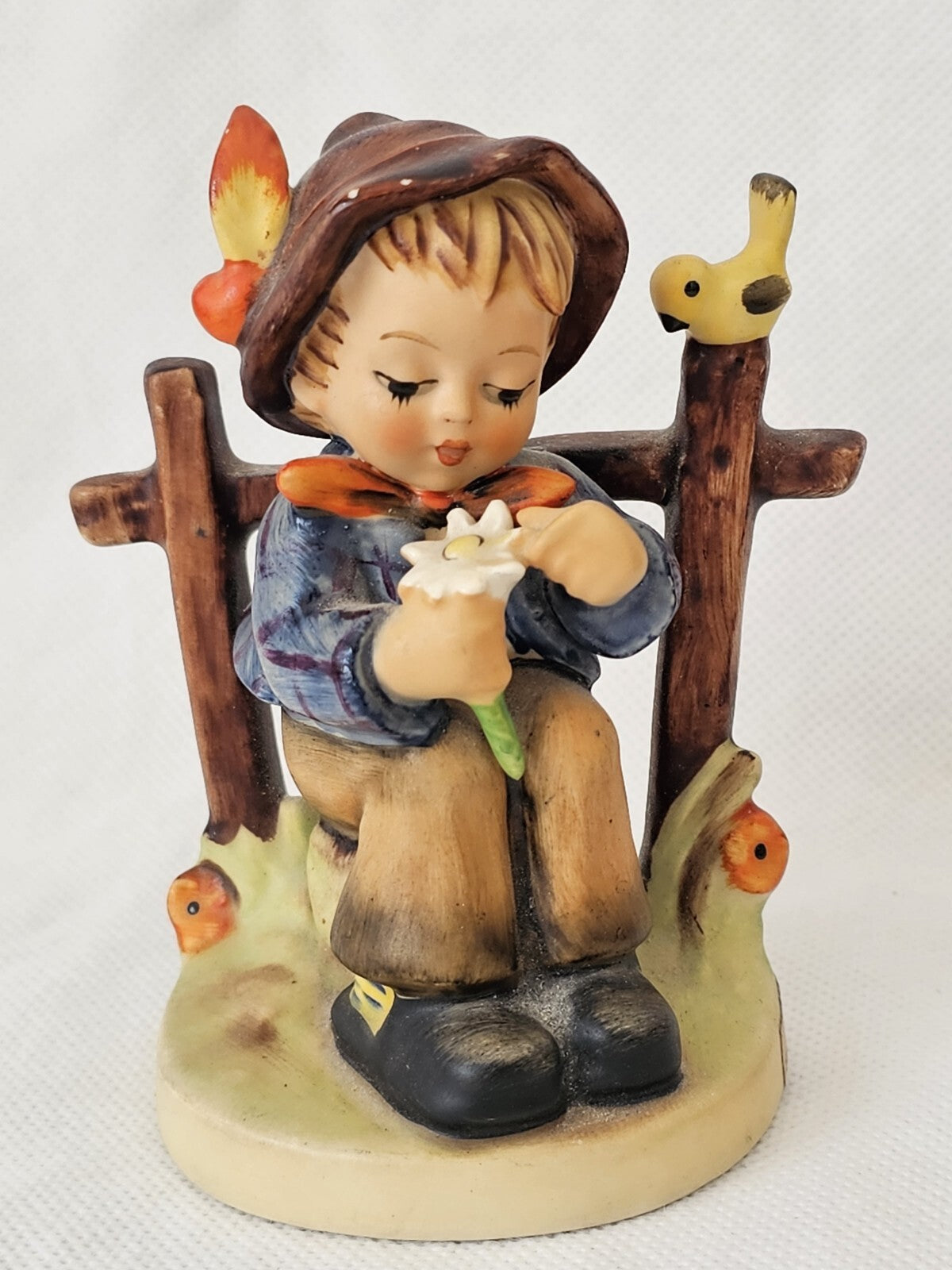 A Vintage Goebel Hummel Figurine 174, 'She Loves me, She loves Me not'