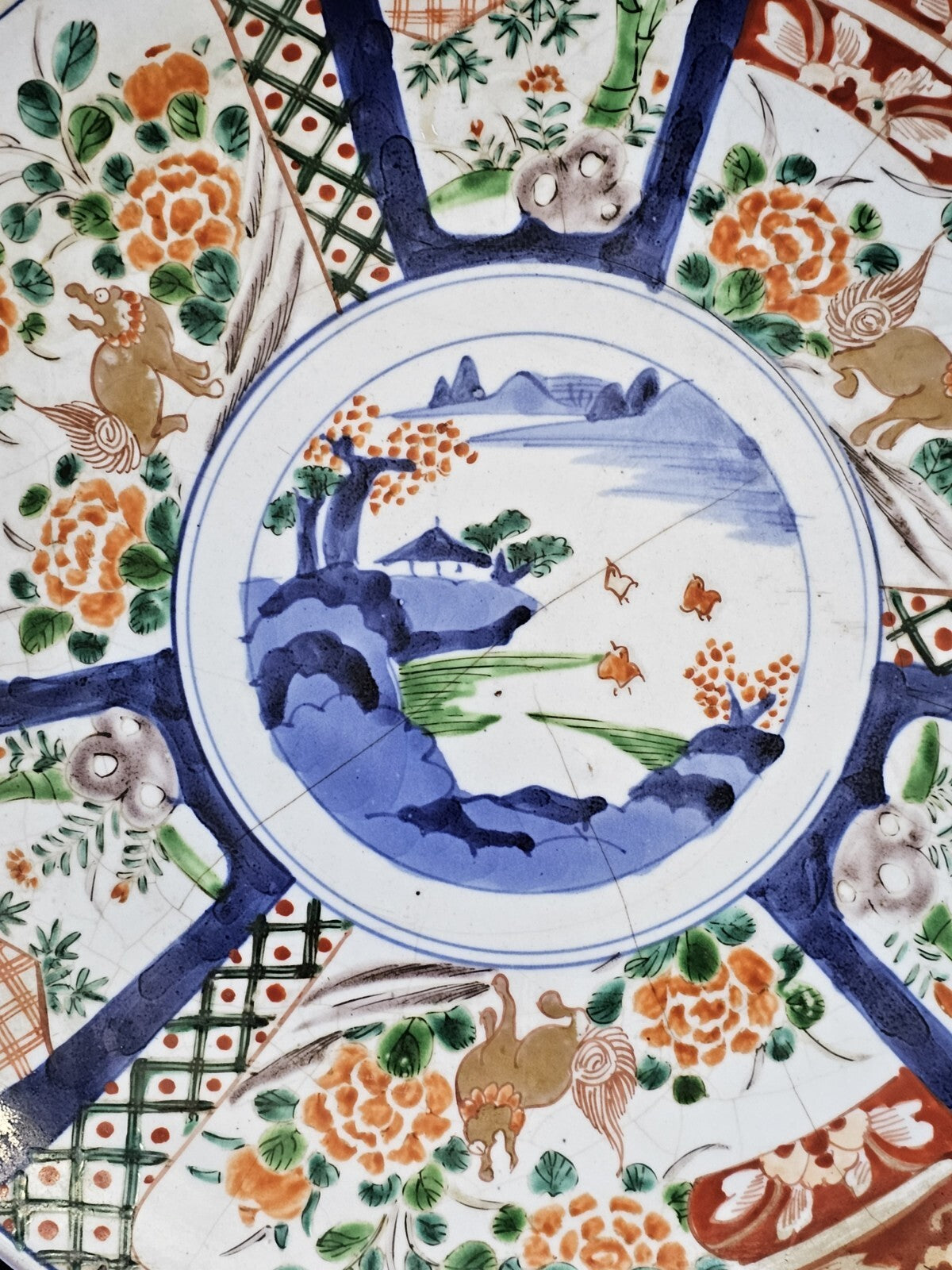 A 19thc Japanese Imari Charger, Hand Painted with a Landscape, Flowers & Animals