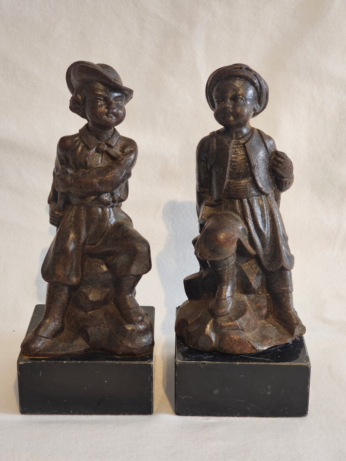 A Pair of French  Bronzed Spelter Statuettes Of Boys on a Marble Base, Signed