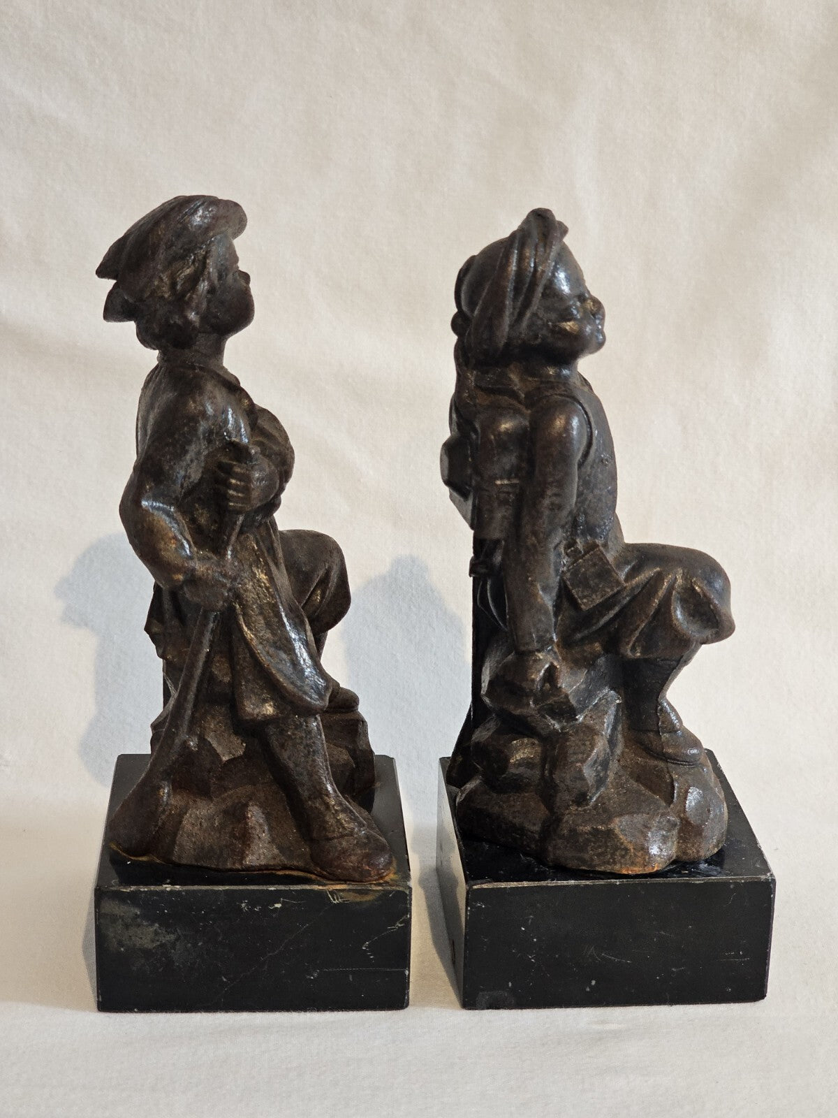 A Pair of French  Bronzed Spelter Statuettes Of Boys on a Marble Base, Signed