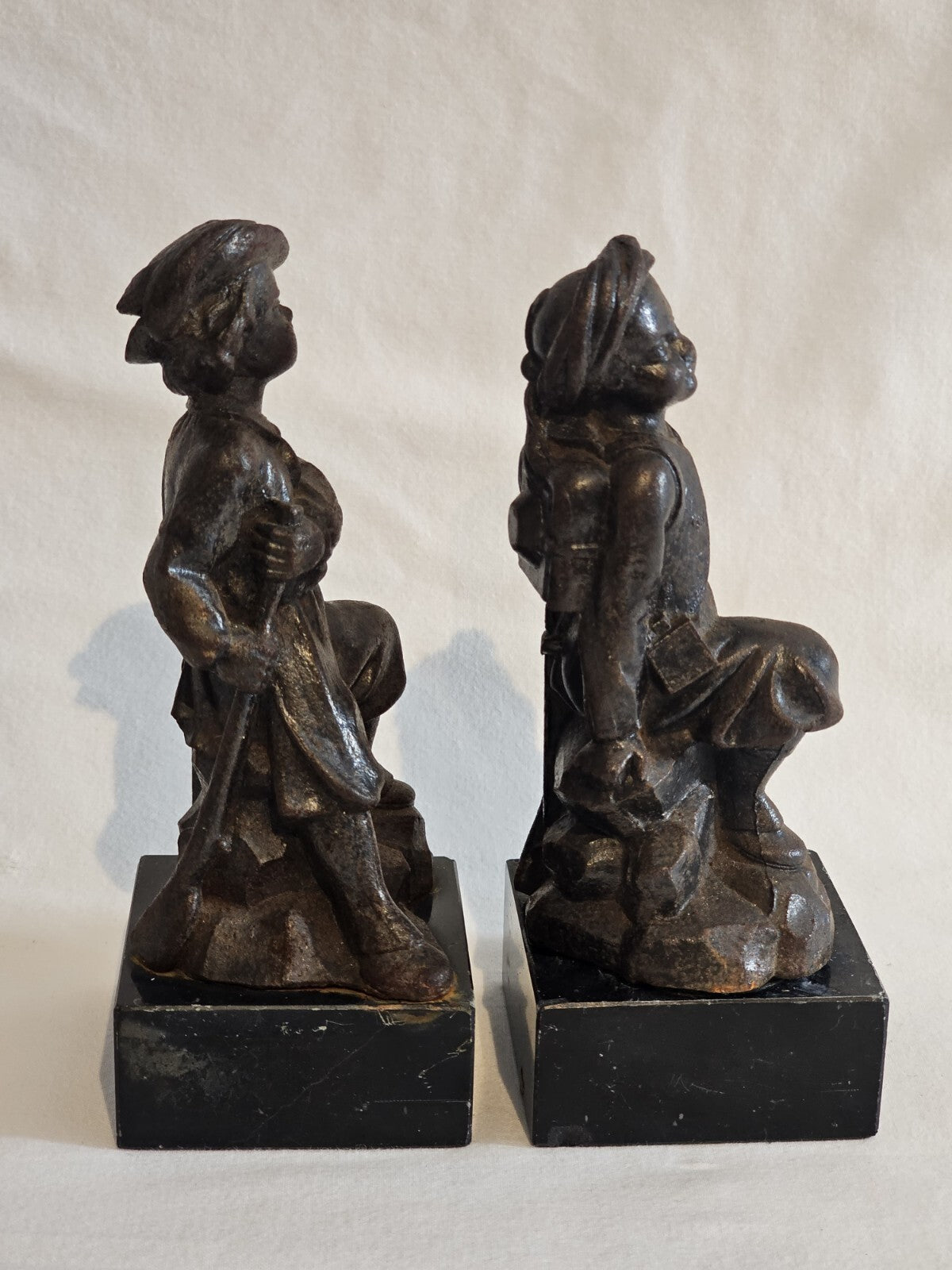 A Pair of French  Bronzed Spelter Statuettes Of Boys on a Marble Base, Signed