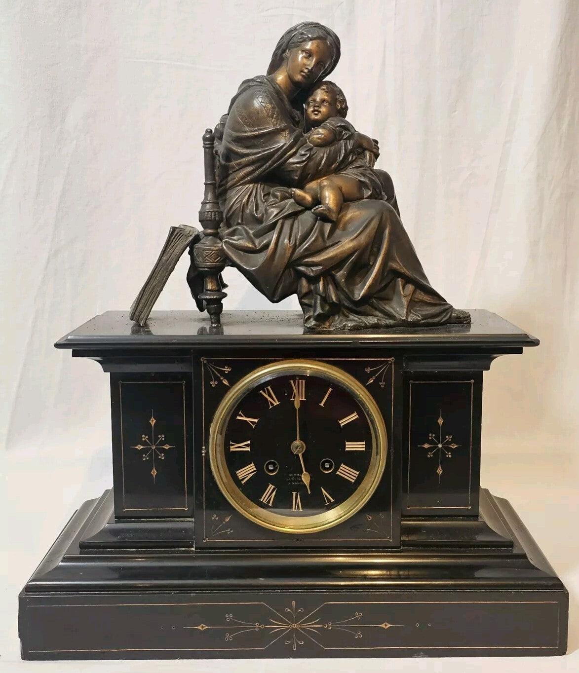 A Belgian Slate Mantle Clock, Mounted with a Spelter Figural Group