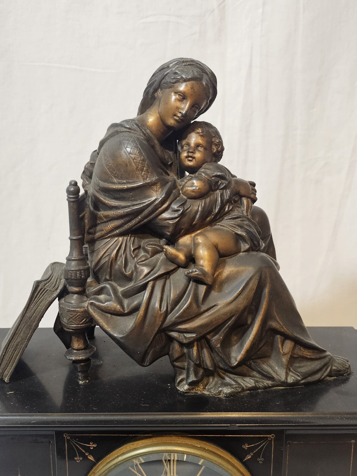 A Belgian Slate Mantle Clock, Mounted with a Spelter Figural Group