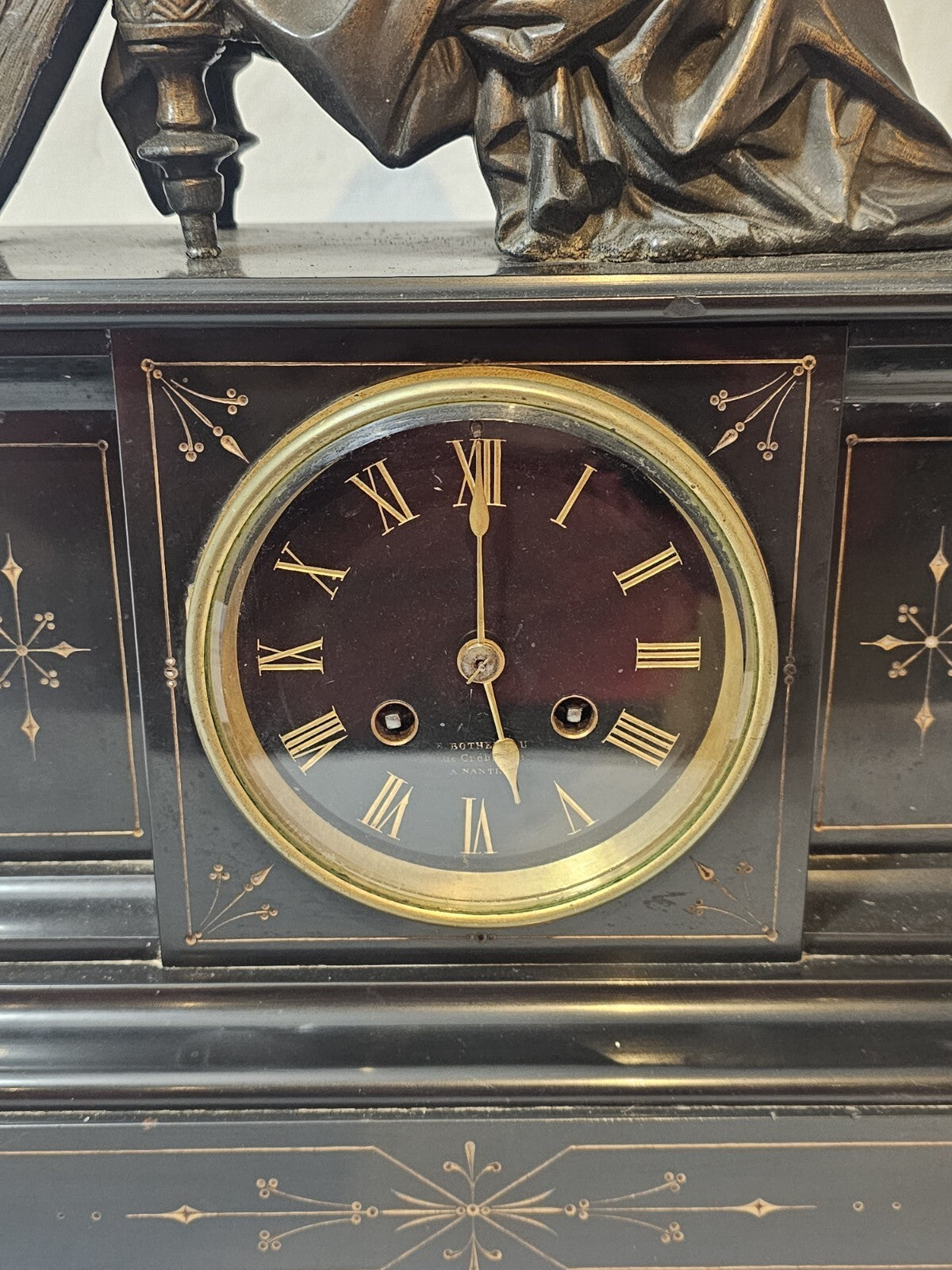 A Belgian Slate Mantle Clock, Mounted with a Spelter Figural Group