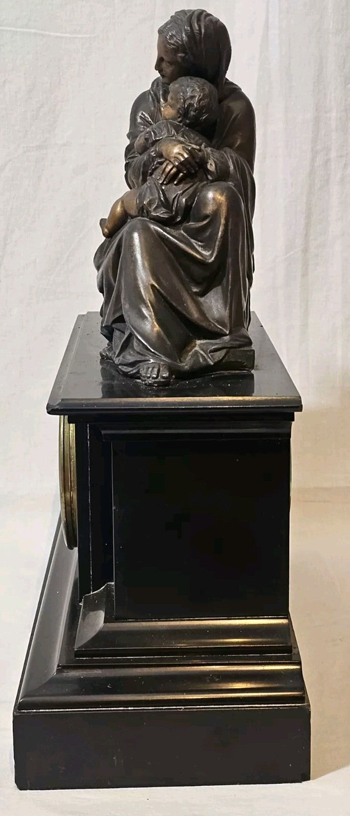 A Belgian Slate Mantle Clock, Mounted with a Spelter Figural Group