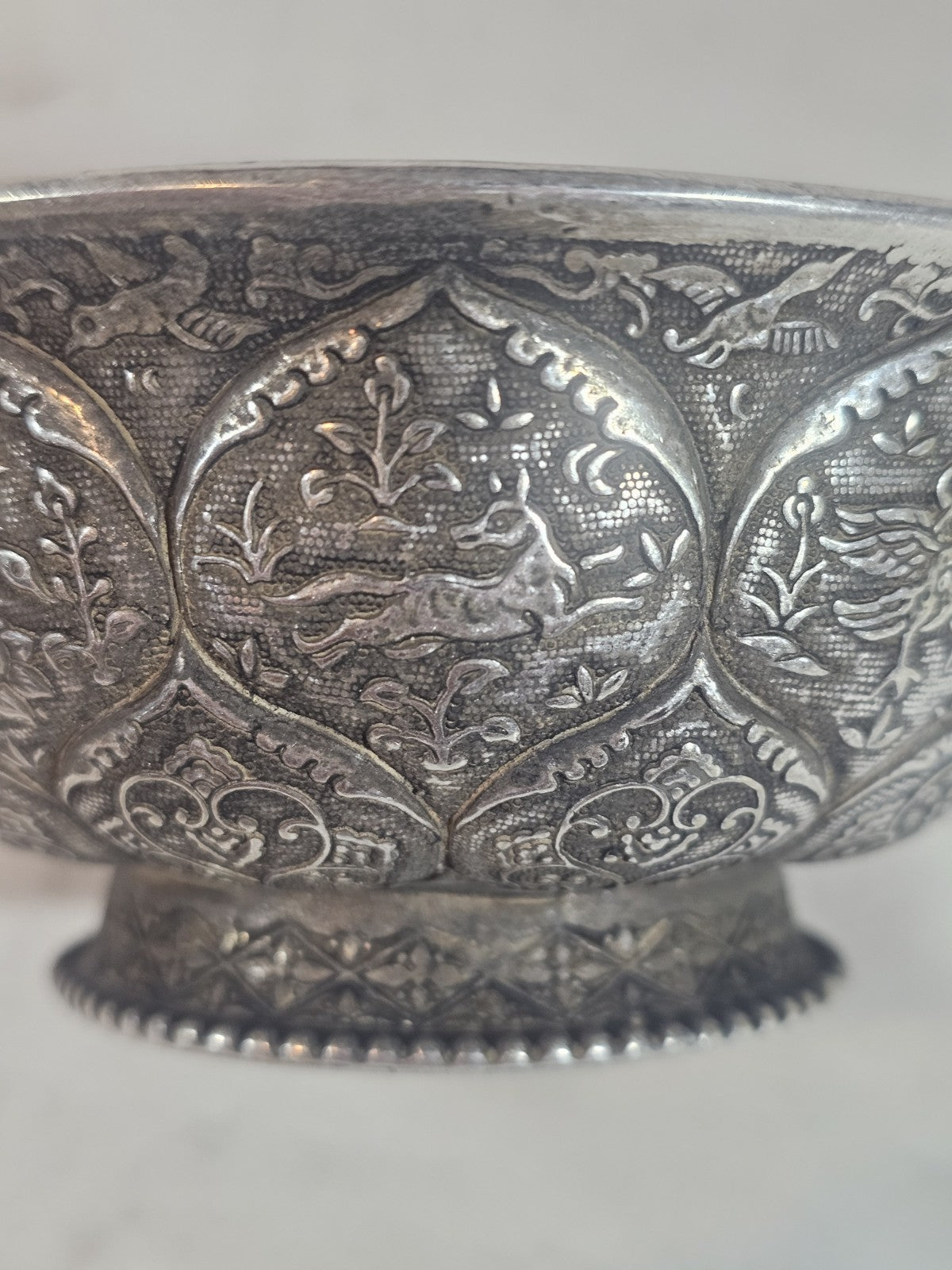 An Antique Chinese White Metal Repoussé Bowl  Decorated inside and out