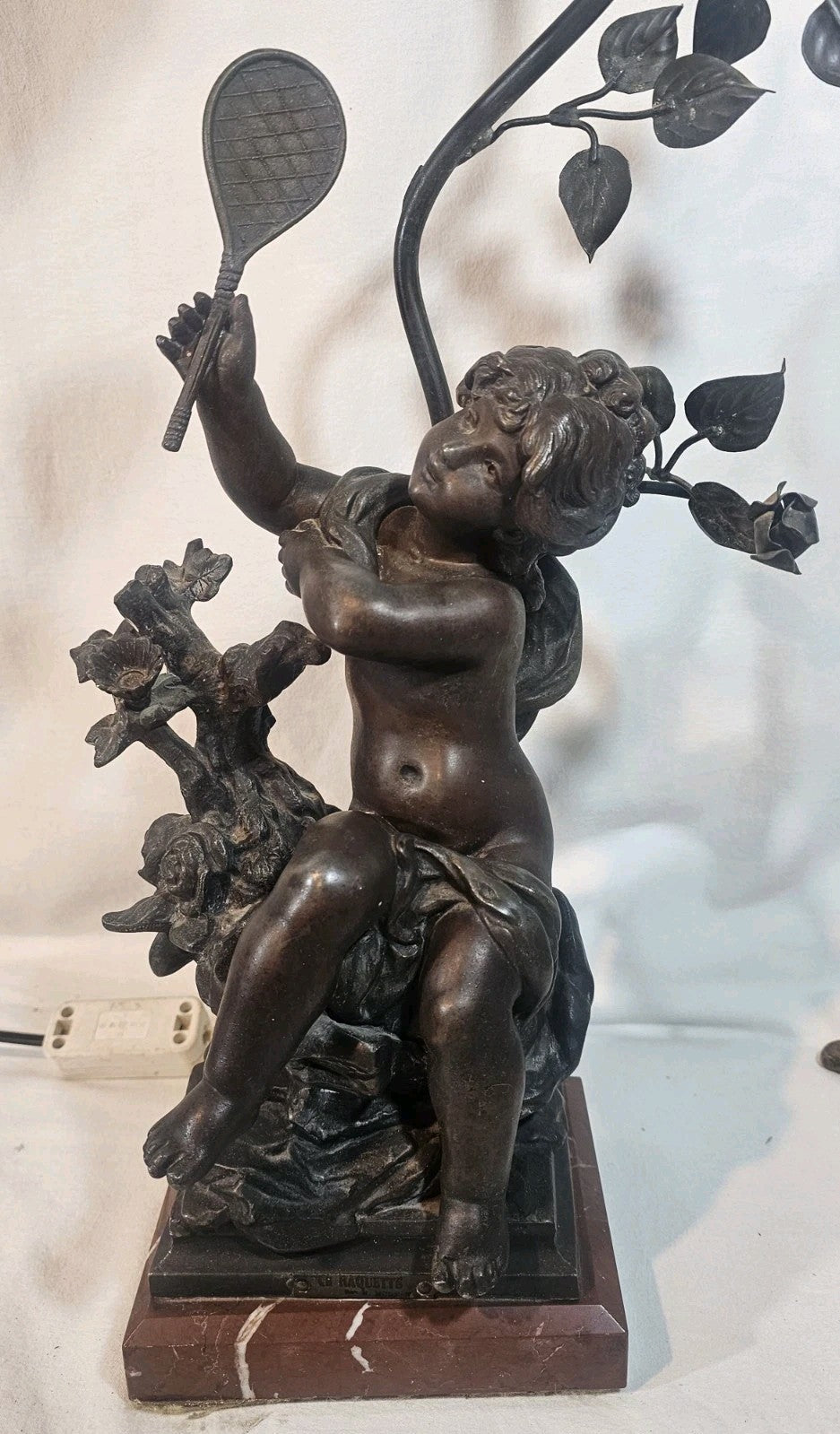 An Antique Spelter Figural Lamp of a Semi Nude Girl Playing Racket Marble Base