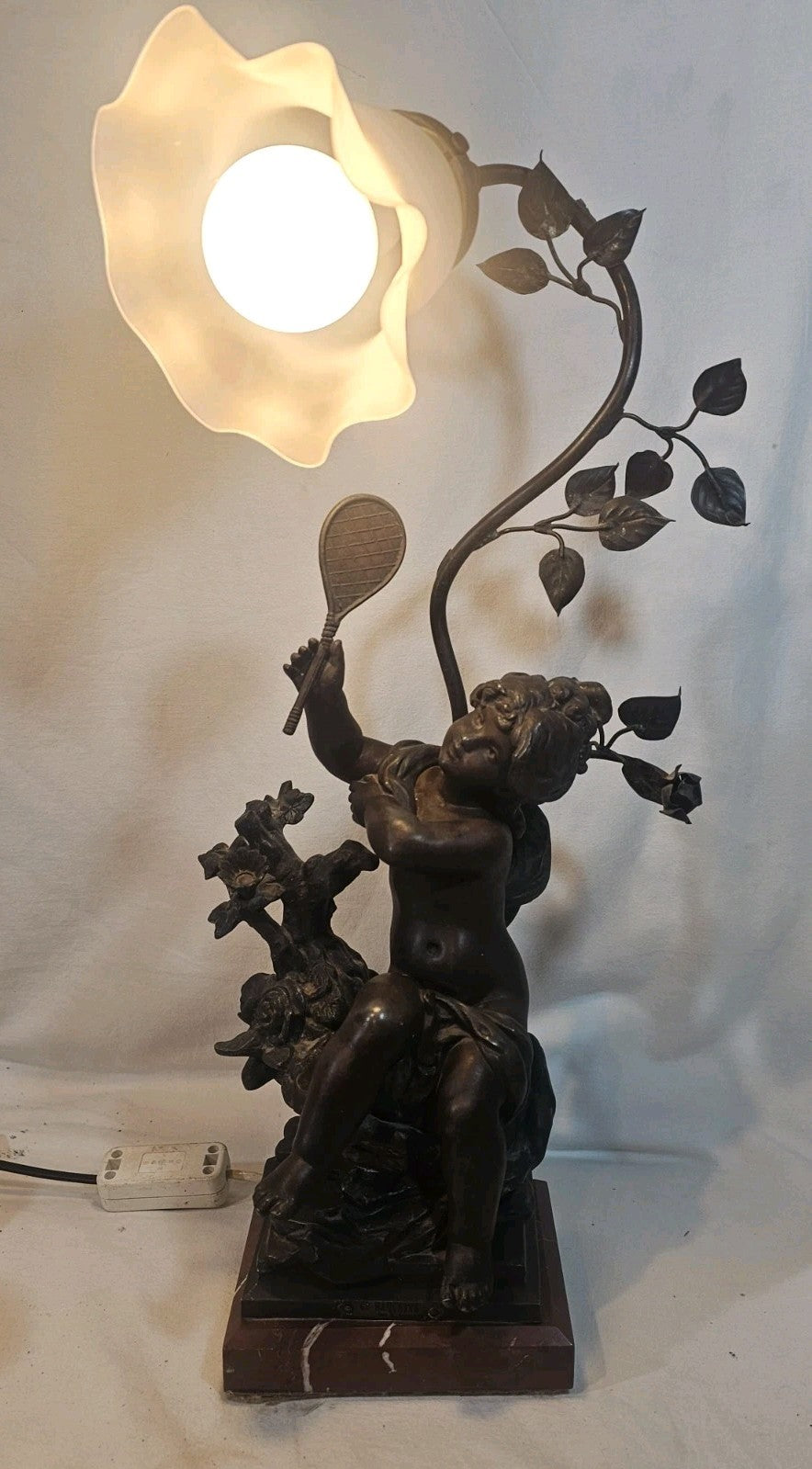 An Antique Spelter Figural Lamp of a Semi Nude Girl Playing Racket Marble Base