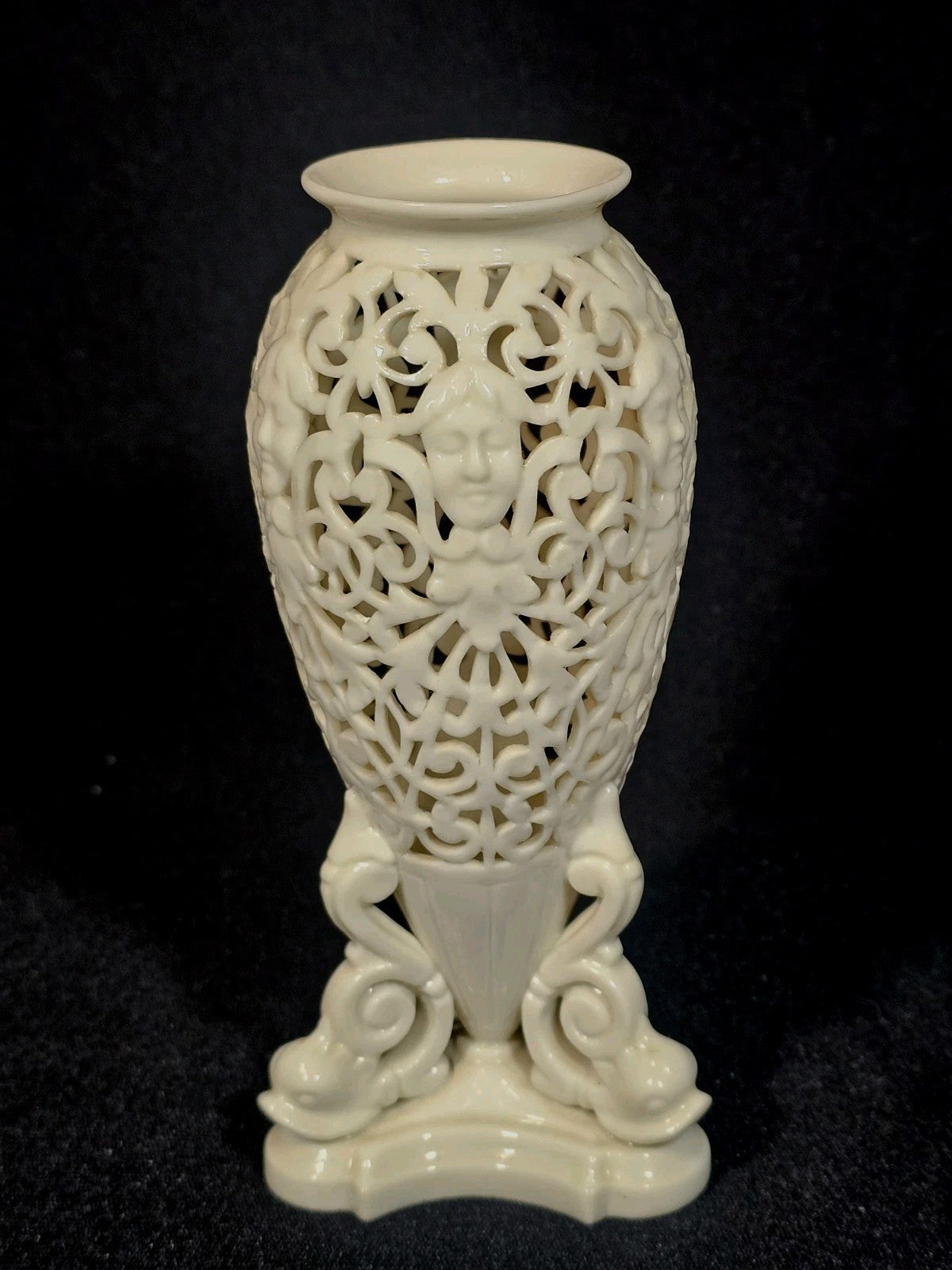 An Antique White Porcelain Grainger Vase Reticulated with Faces on 3 Fish Feet
