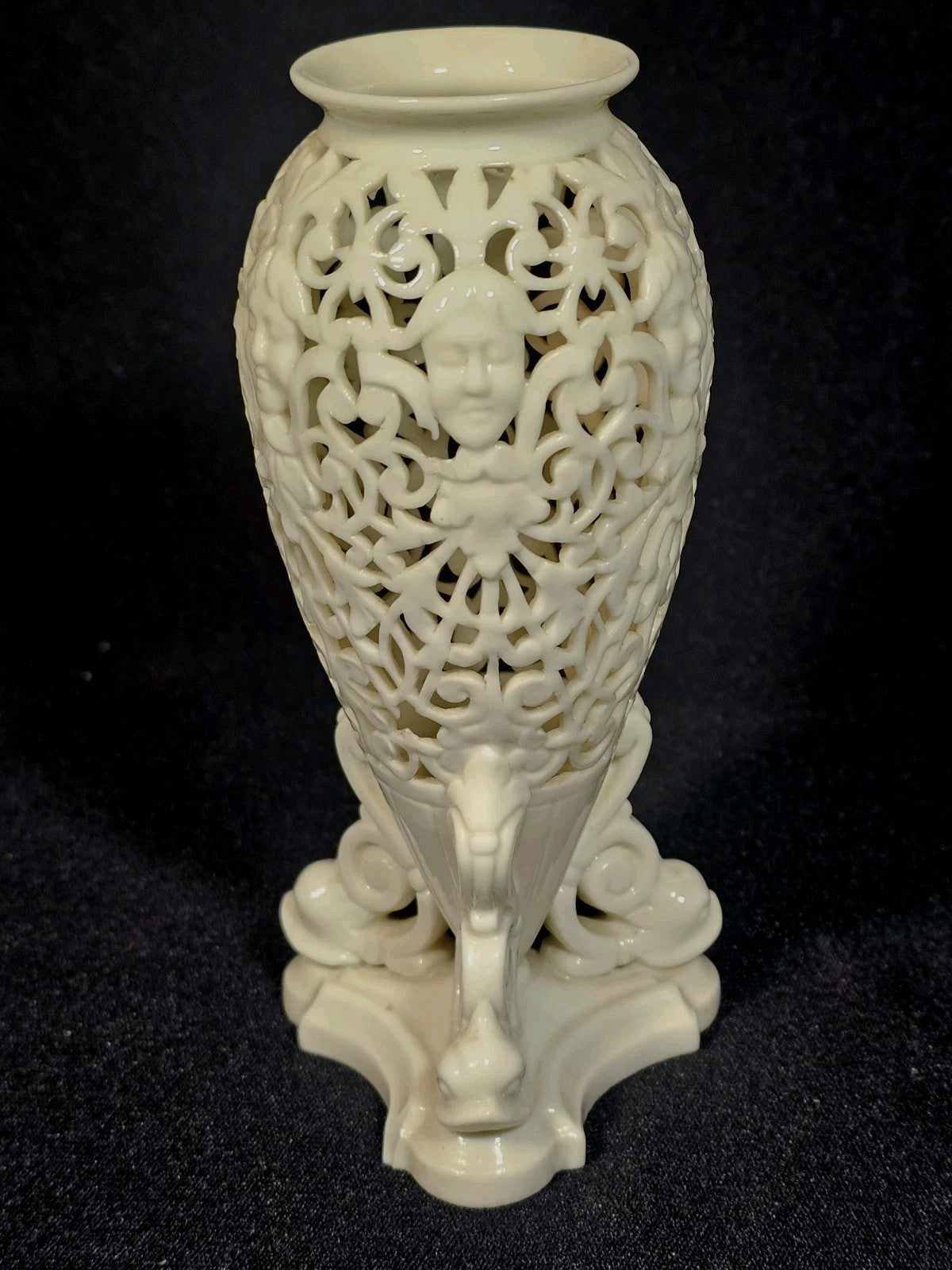 An Antique White Porcelain Grainger Vase Reticulated with Faces on 3 Fish Feet