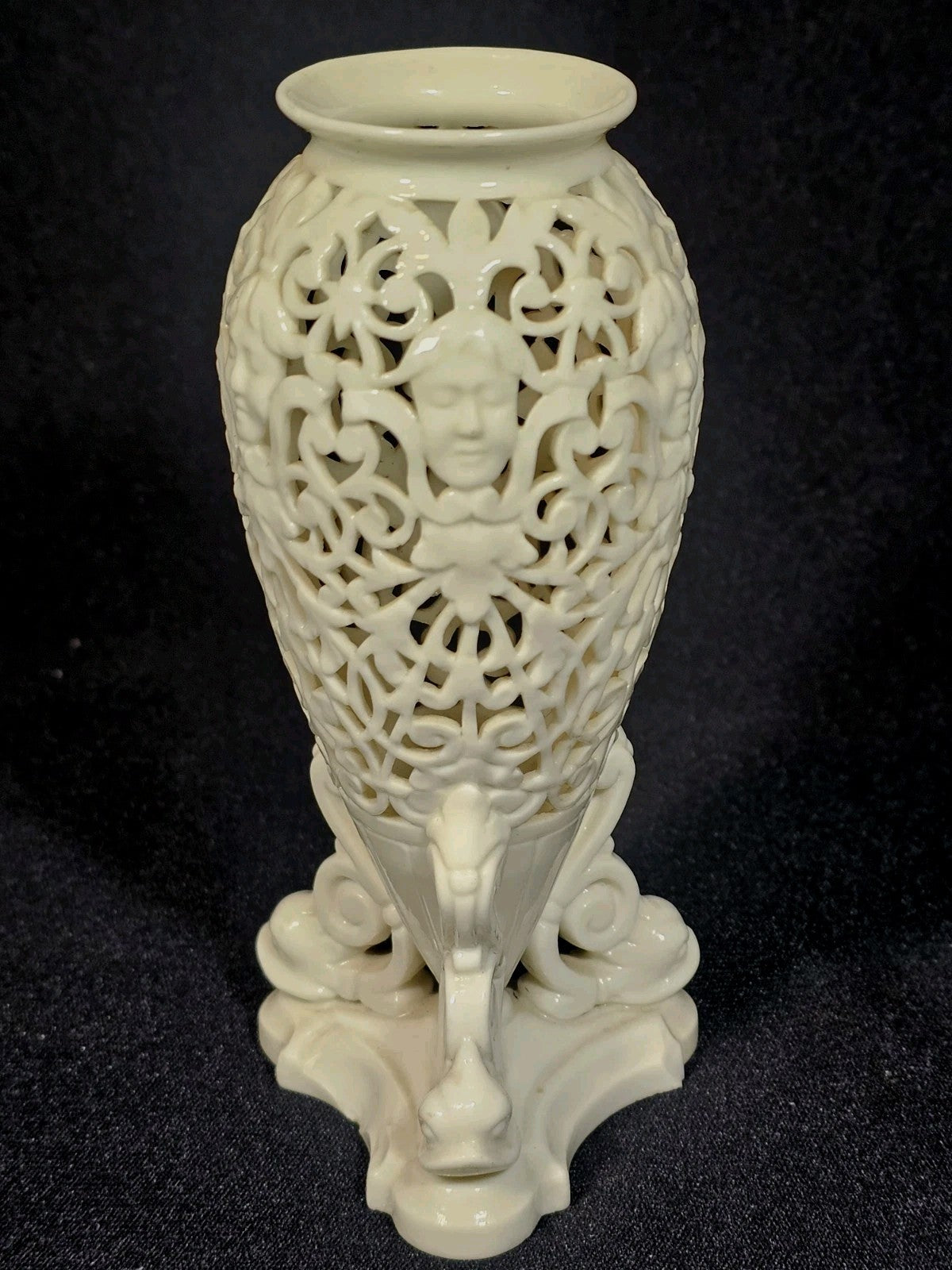An Antique White Porcelain Grainger Vase Reticulated with Faces on 3 Fish Feet