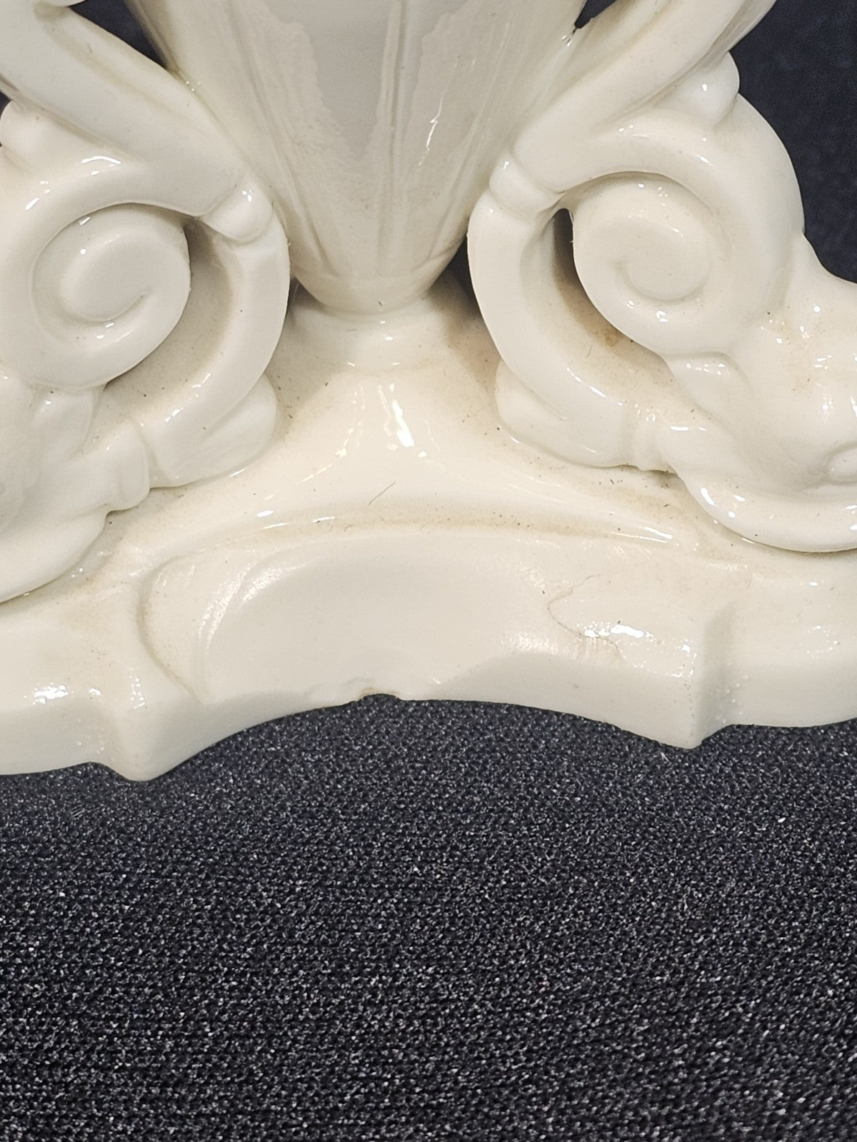 An Antique White Porcelain Grainger Vase Reticulated with Faces on 3 Fish Feet