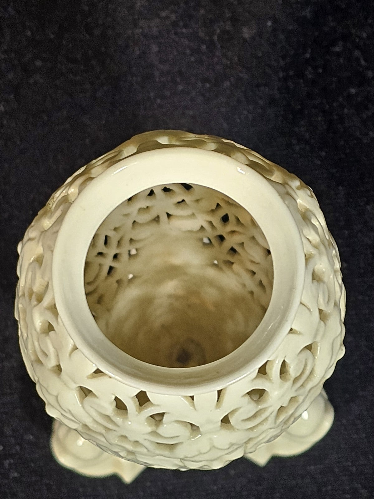 An Antique White Porcelain Grainger Vase Reticulated with Faces on 3 Fish Feet