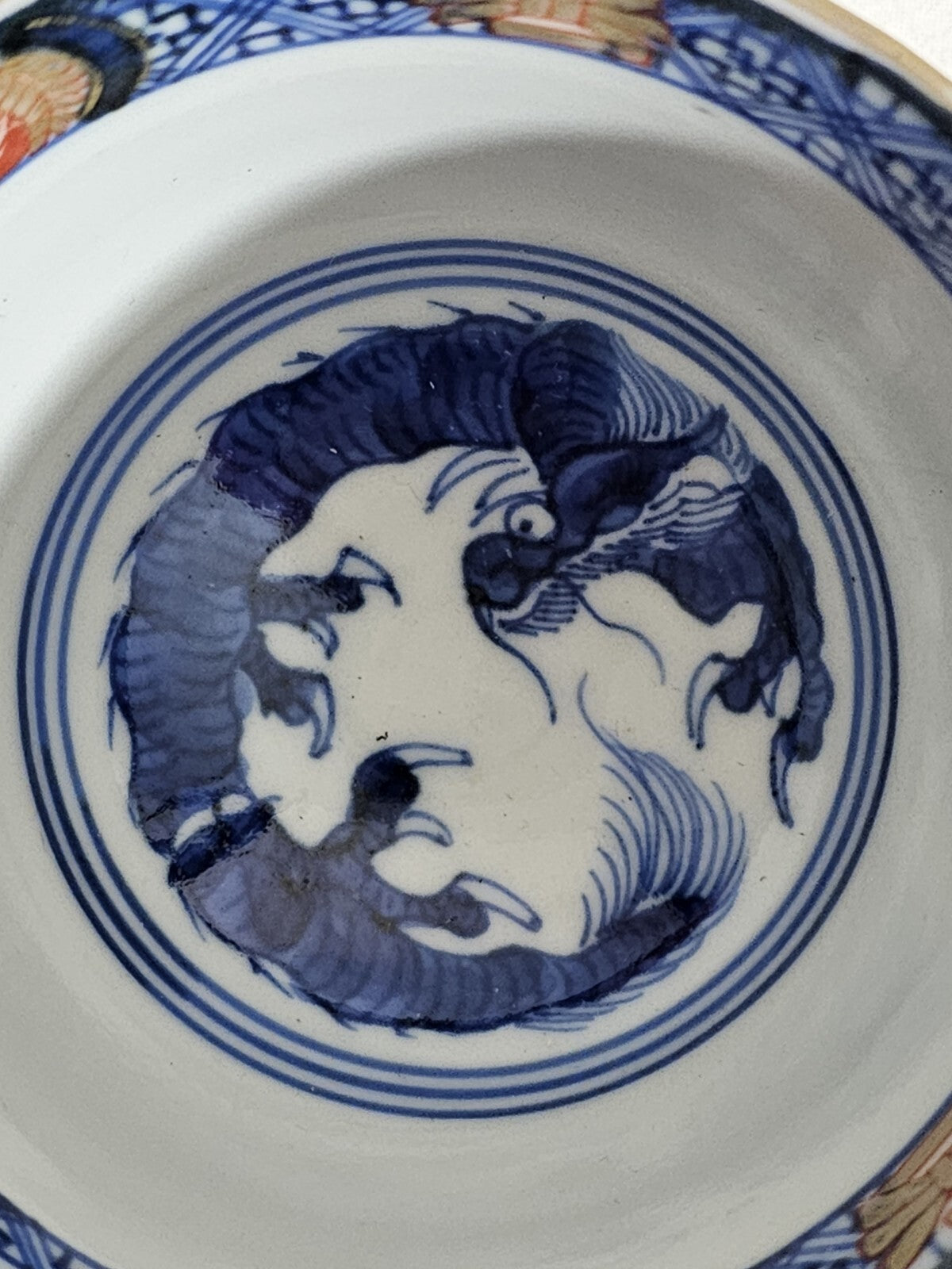 A 19thC Japanese Porcelain Tea Bowl Painted with Stylised Flowers, a Dragon