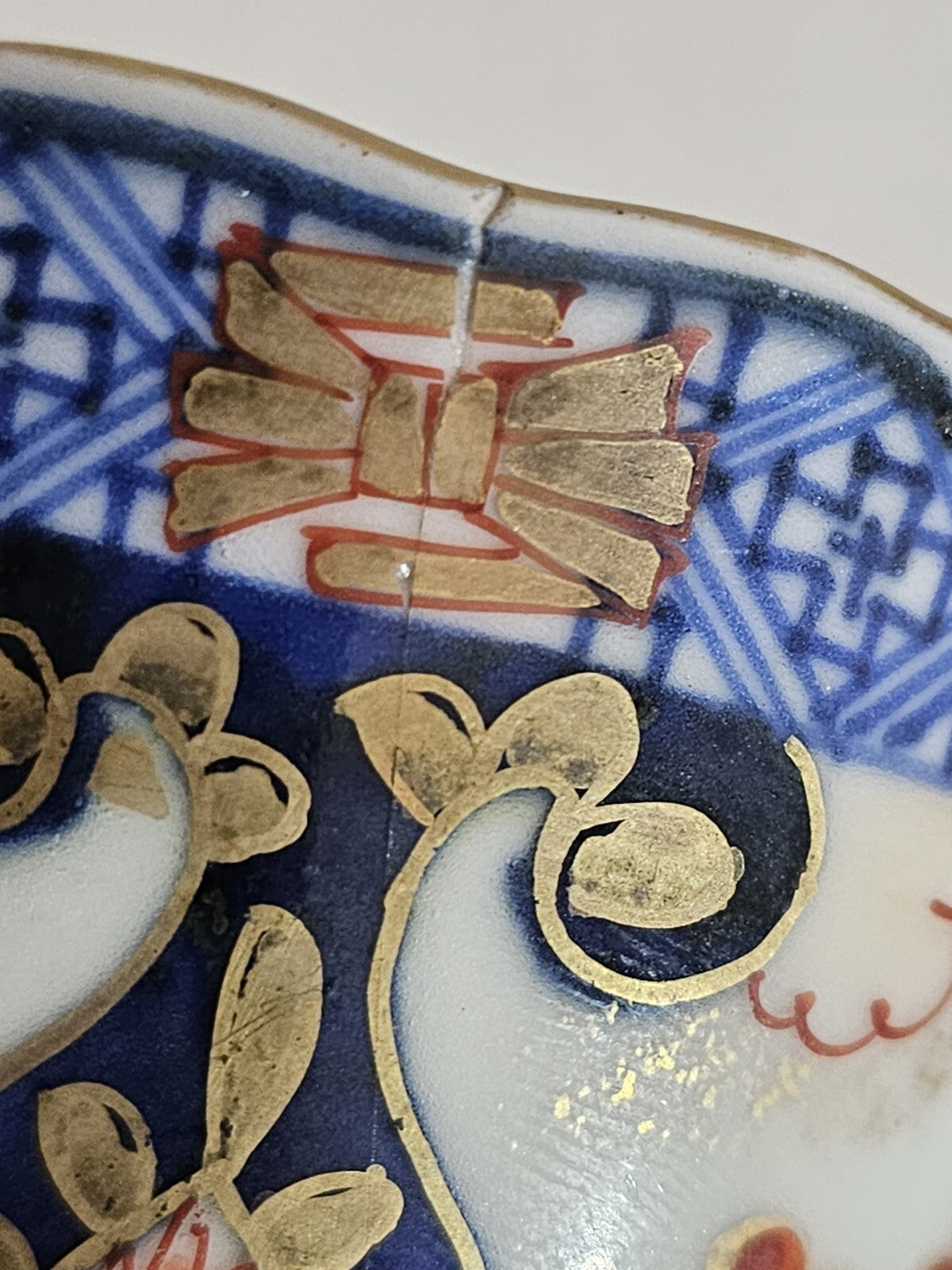 A 19thC Japanese Porcelain Tea Bowl Painted with Stylised Flowers, a Dragon