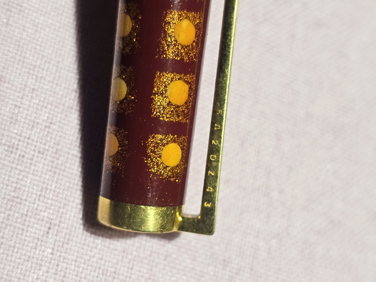 An S.T. Dupont Paris Laque de Chine Red & Gold Ballpoint Pen Gold Plated