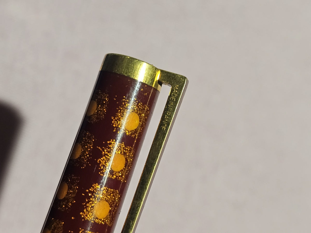 An S.T. Dupont Paris Laque de Chine Red & Gold Ballpoint Pen Gold Plated