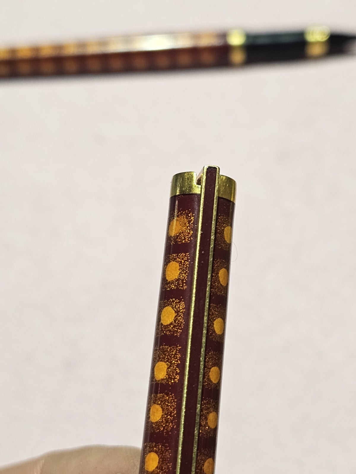 An S.T. Dupont Paris Laque de Chine Red & Gold Ballpoint Pen Gold Plated
