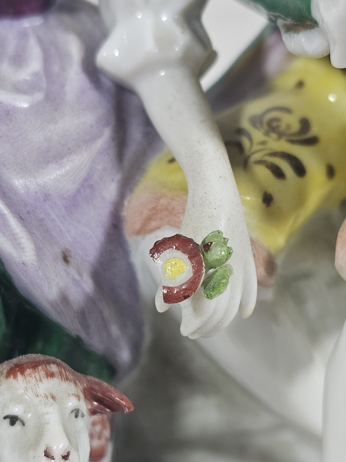A Victorian German Porcelain Figure Group of a Couple Seated, Hand Painted