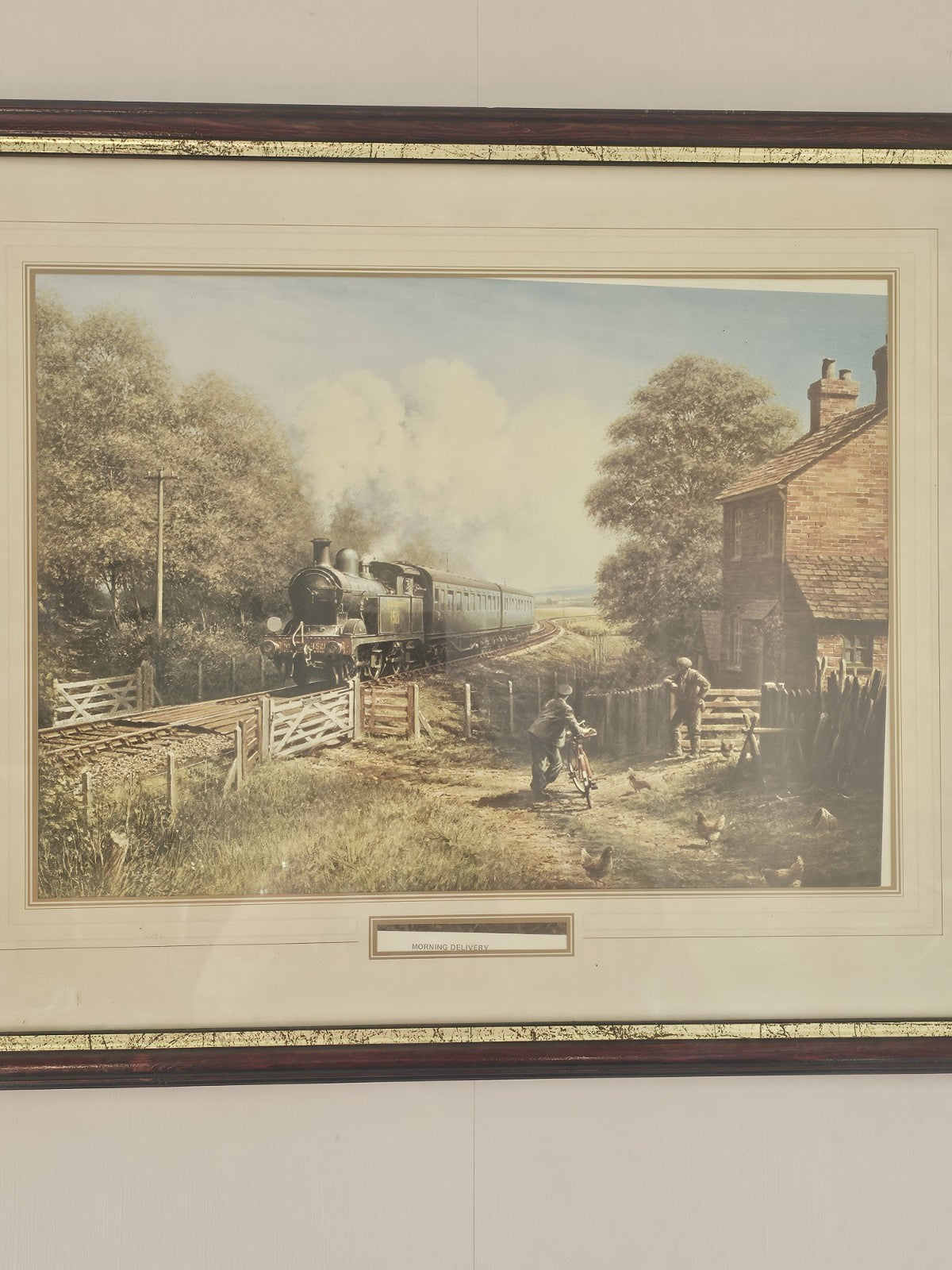 A Vintage Framed Print of a Train and Village Titled - Morning Delivery