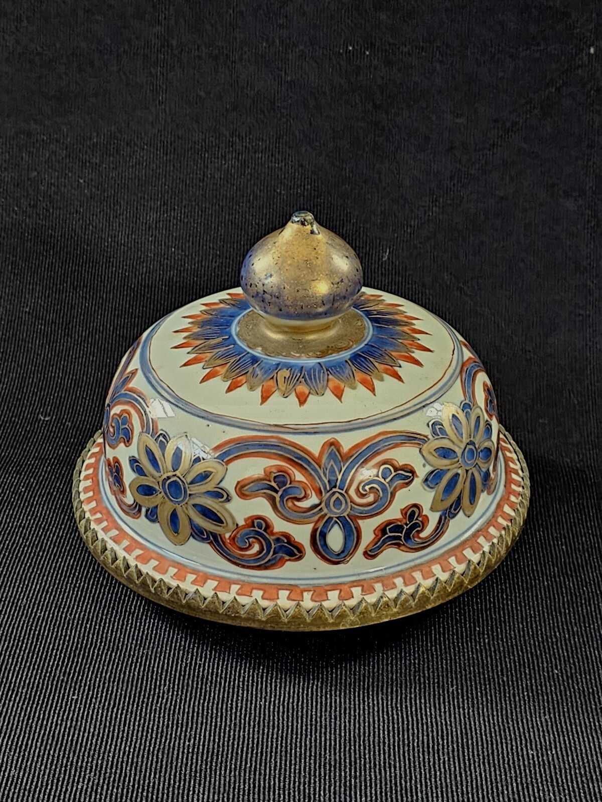 An Antique Chinese Porcelain Vase or Jar Cover, Encased in Brass