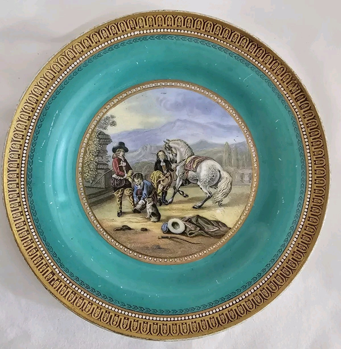 An Antique 19thC Prattware Plate with Green Boarder - Preparing for the Ride