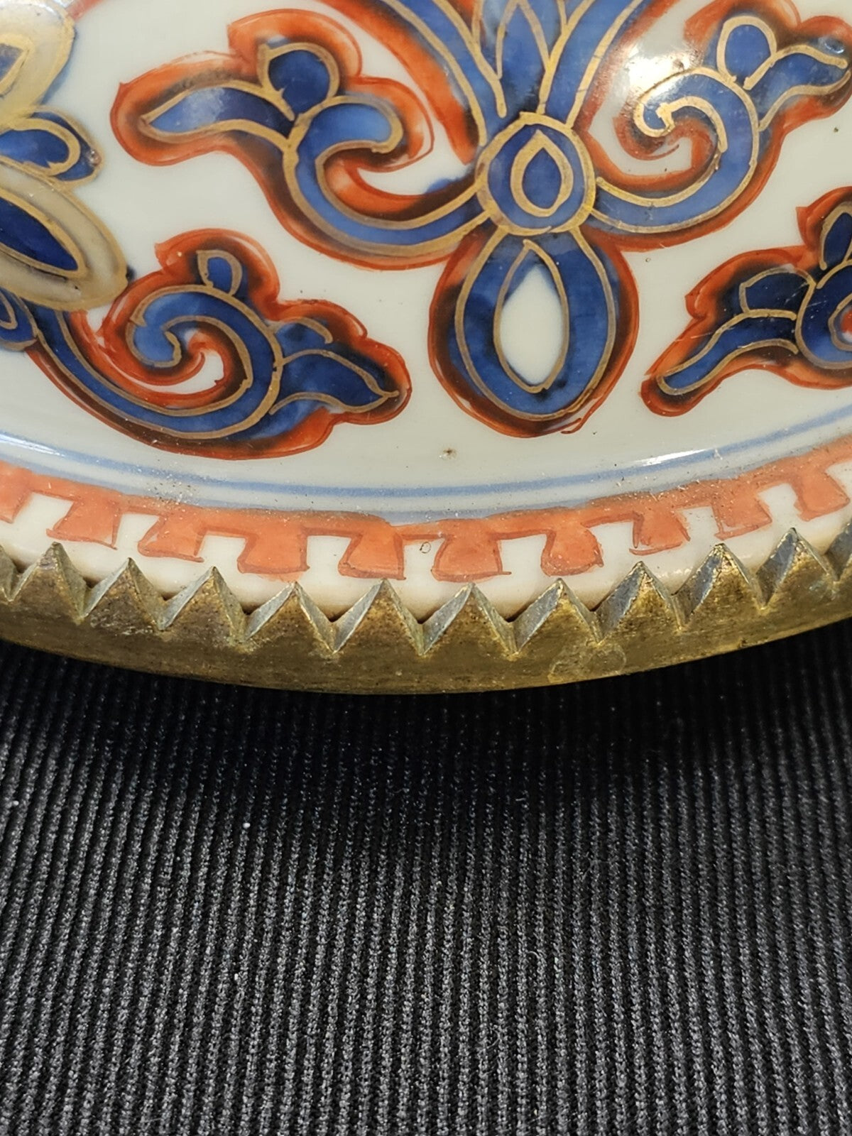 An Antique Chinese Porcelain Vase or Jar Cover, Encased in Brass