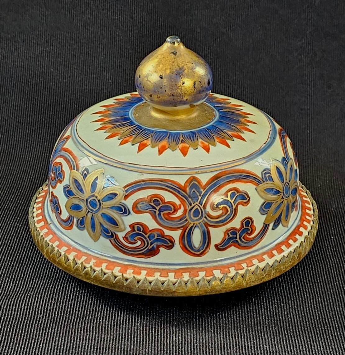 An Antique Chinese Porcelain Vase or Jar Cover, Encased in Brass